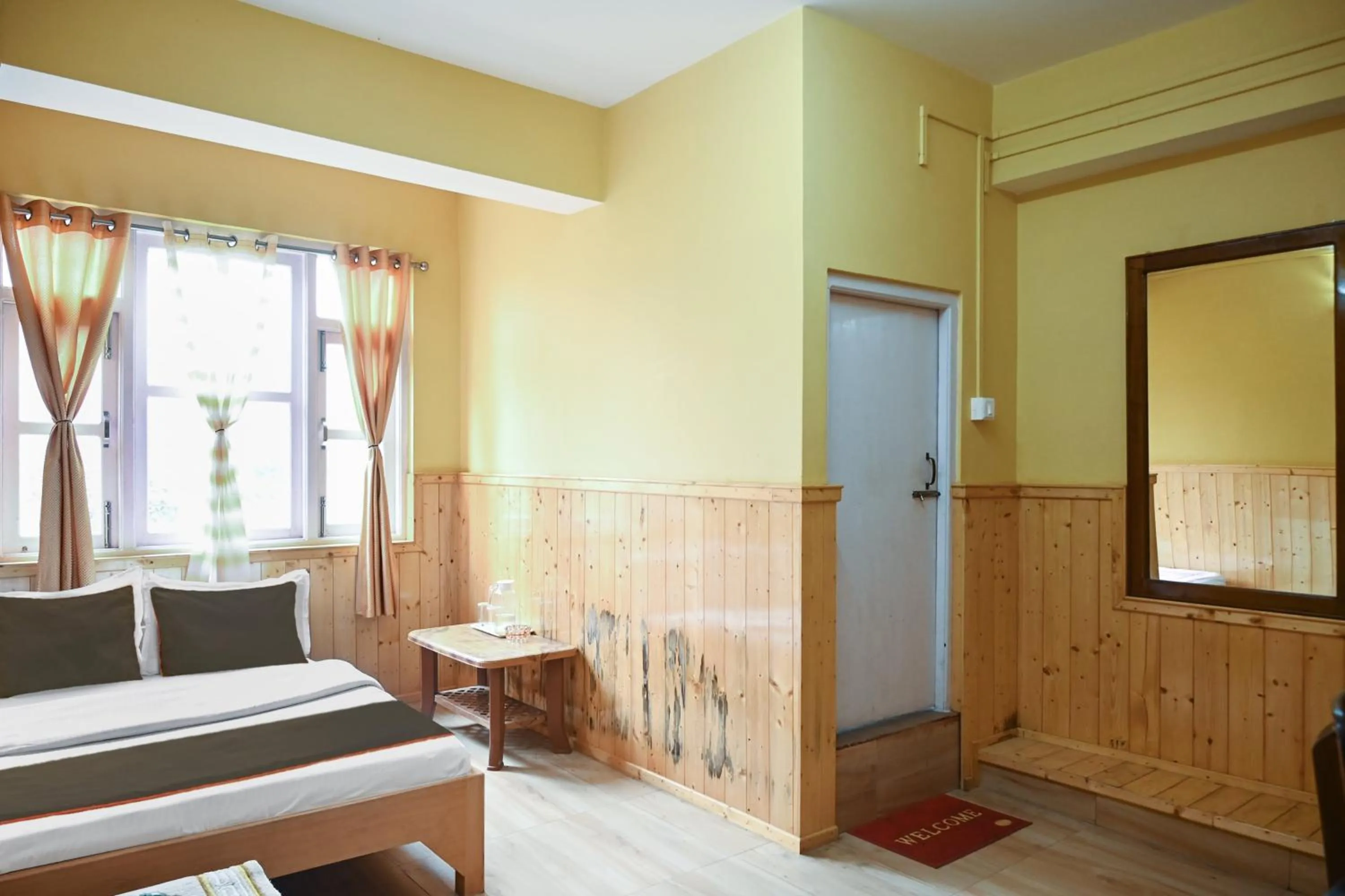 Bedroom in Hotel O Kaizen Residency