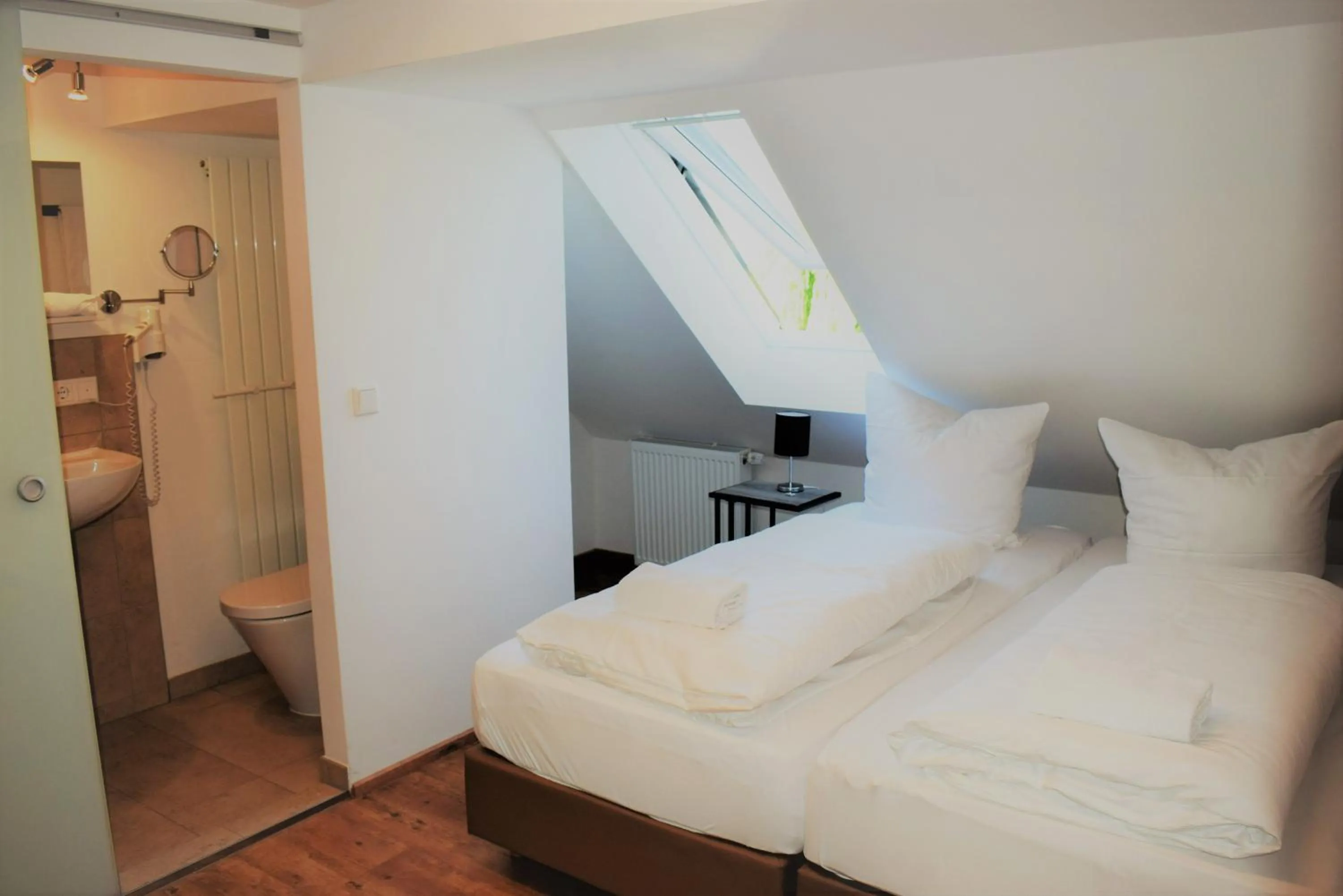 Photo of the whole room, Bed in Hotel Stanglbräu