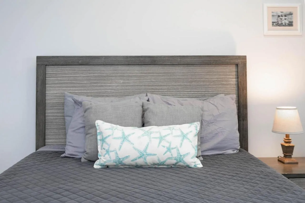 Bed in Sea Glass Cottage - An Oceanfront Experience