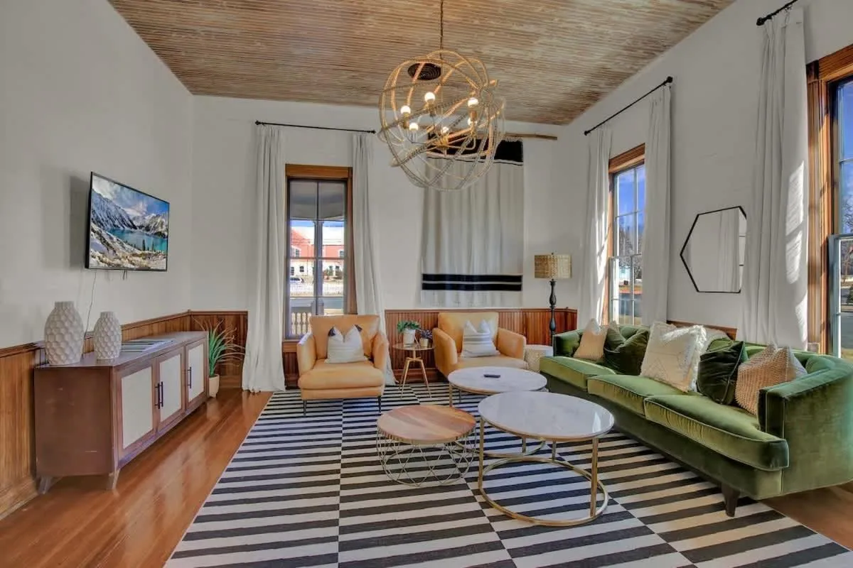 Living room, Bed in Gorgeous Home 1 Blk from Main with Hot Tub & Fire Pit!