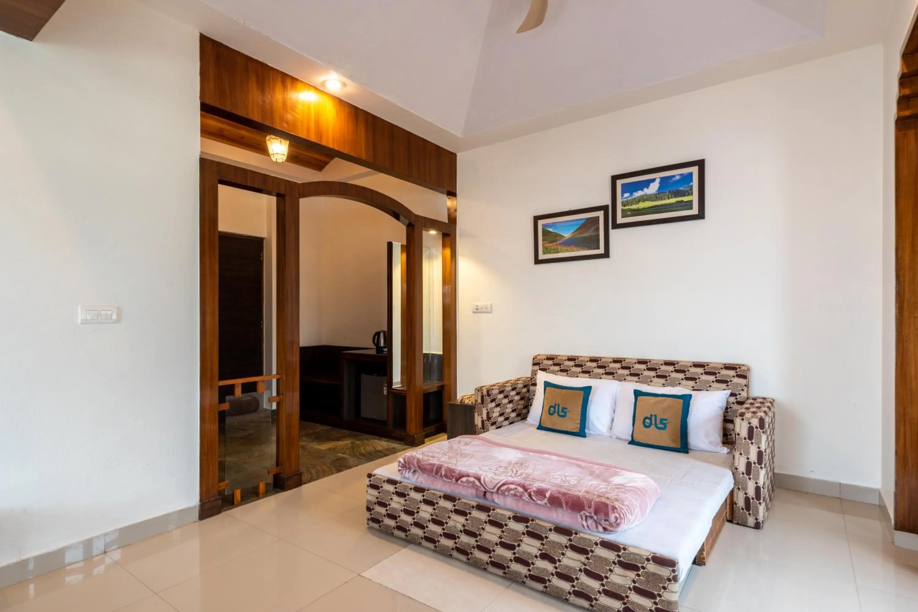 Bed, Seating Area in Meghavan Resort By DLS Hotels