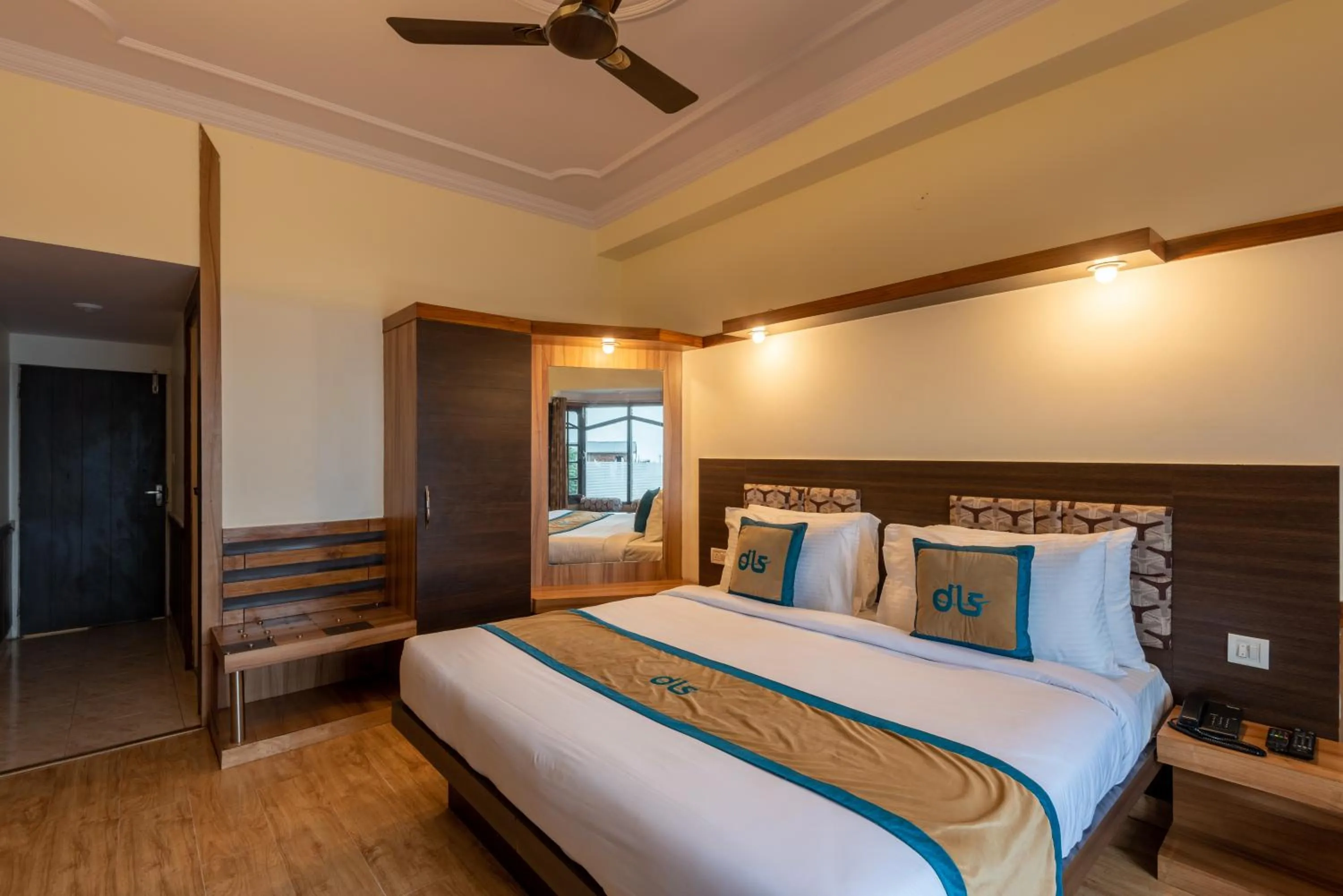 Bed in Meghavan Resort By DLS Hotels