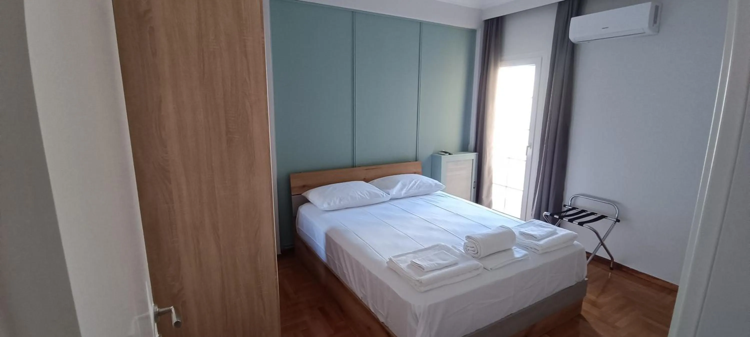 Bed in Artemis Plaza Suites