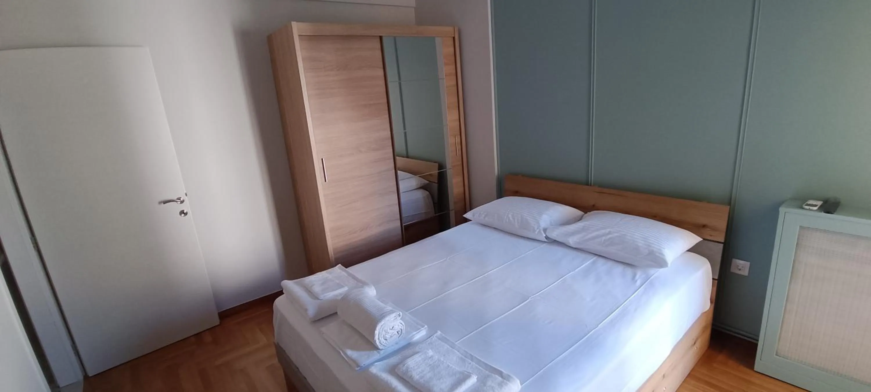 Bed in Artemis Plaza Suites
