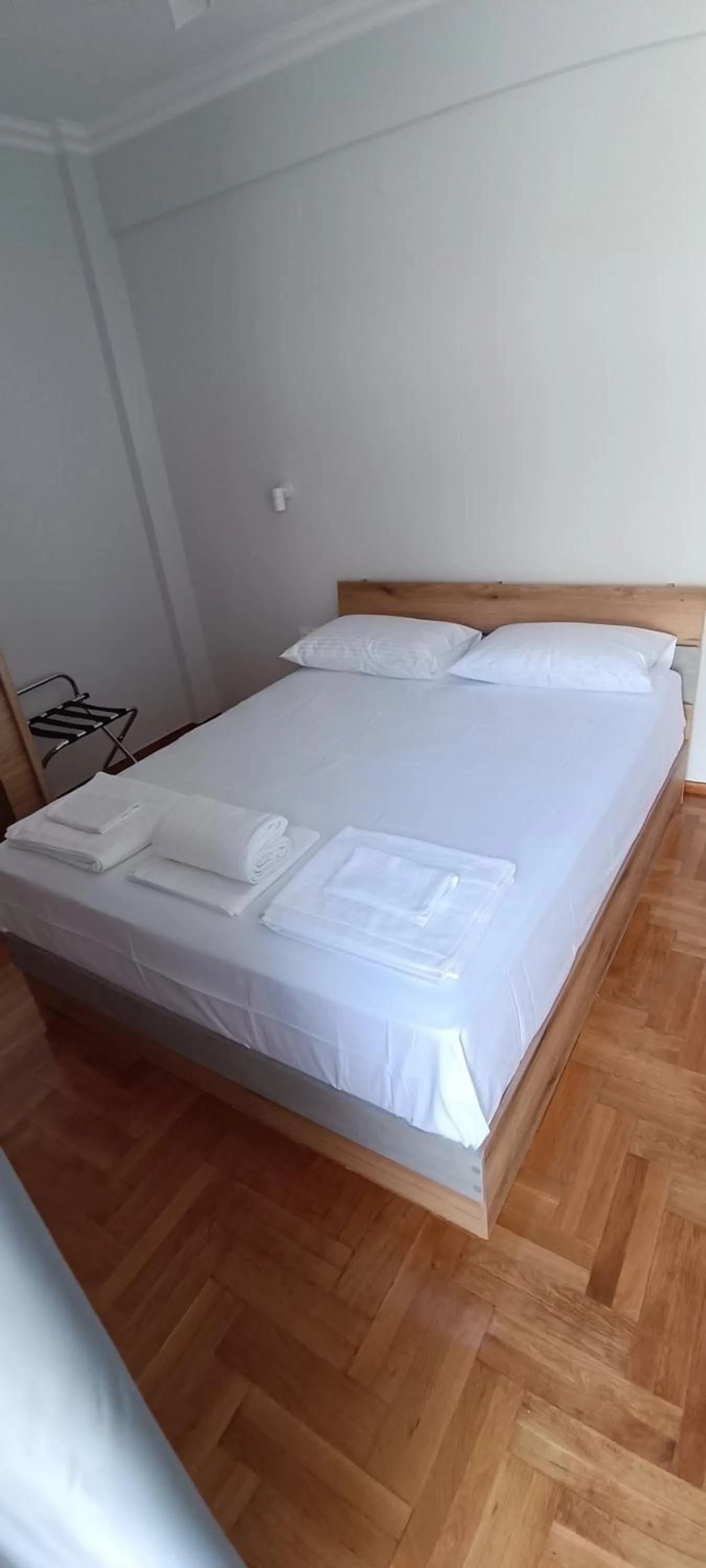 Bed in Artemis Plaza Suites
