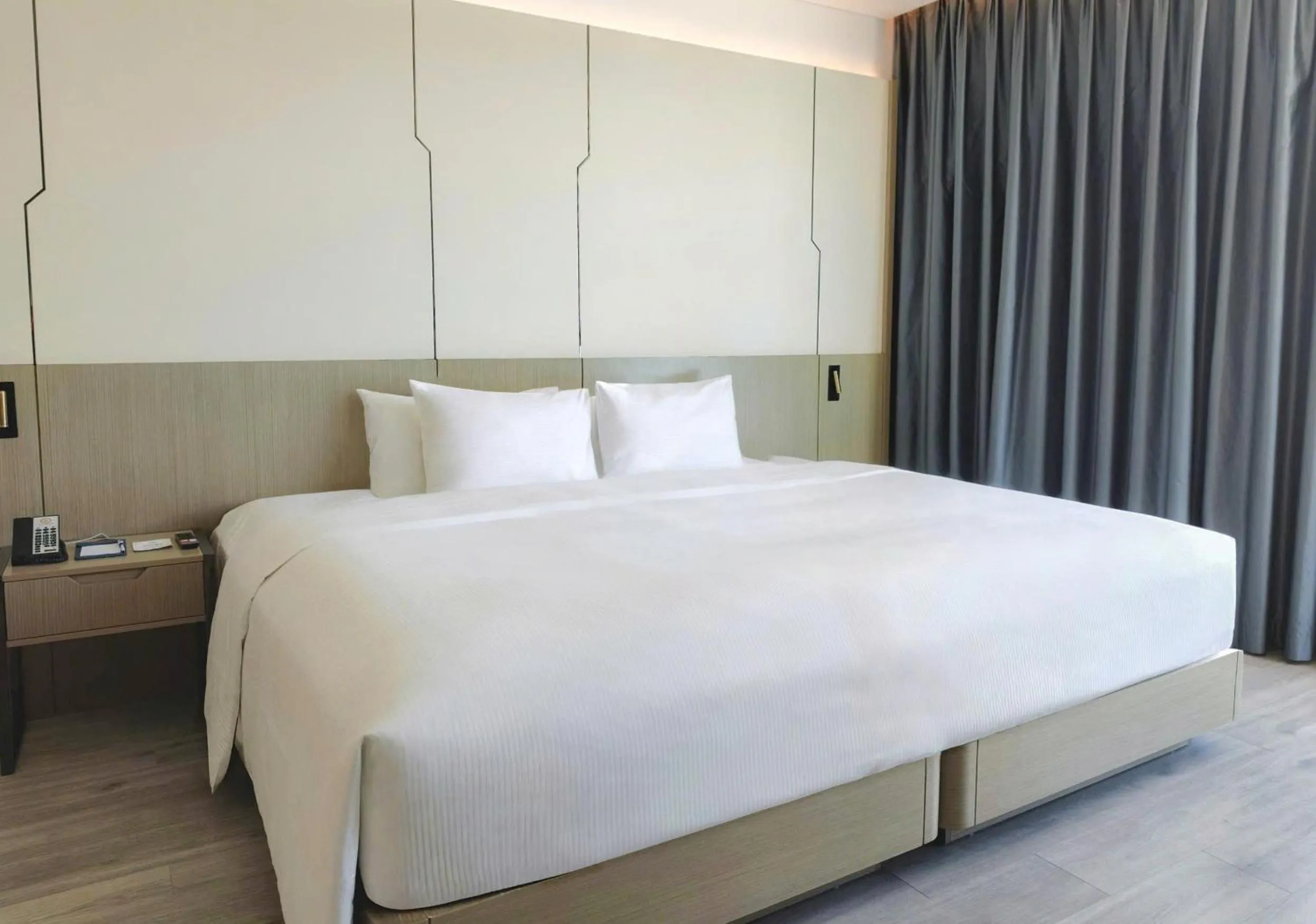 Bed in Awaken Da Nang Hotel