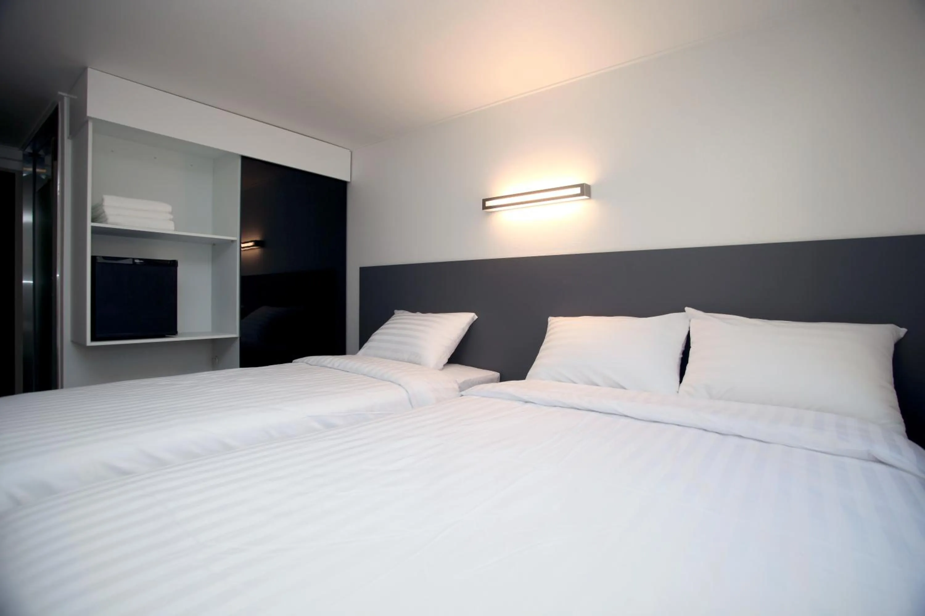 Photo of the whole room, Bed in KSTAR METRO Hotel