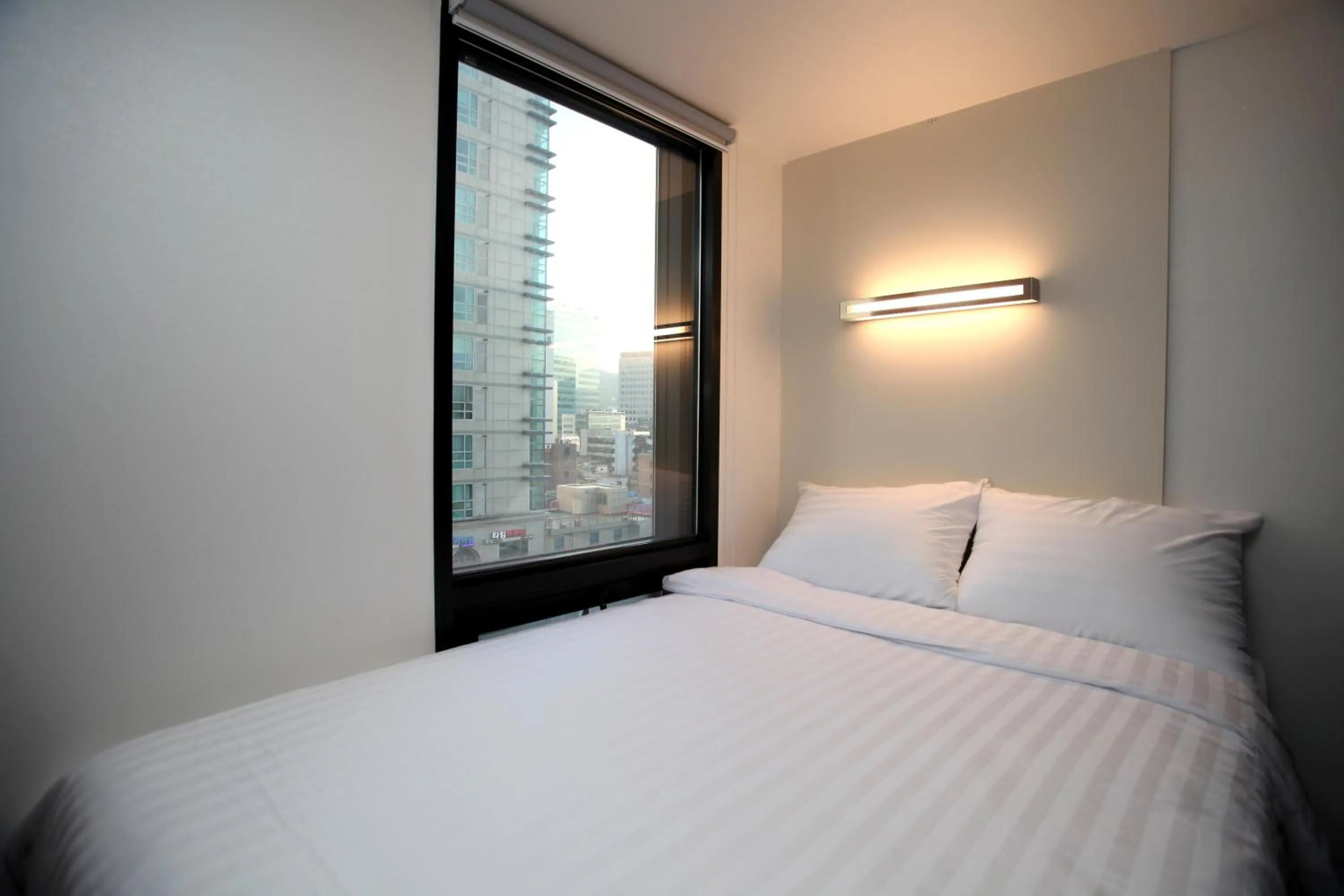 Photo of the whole room, Bed in KSTAR METRO Hotel