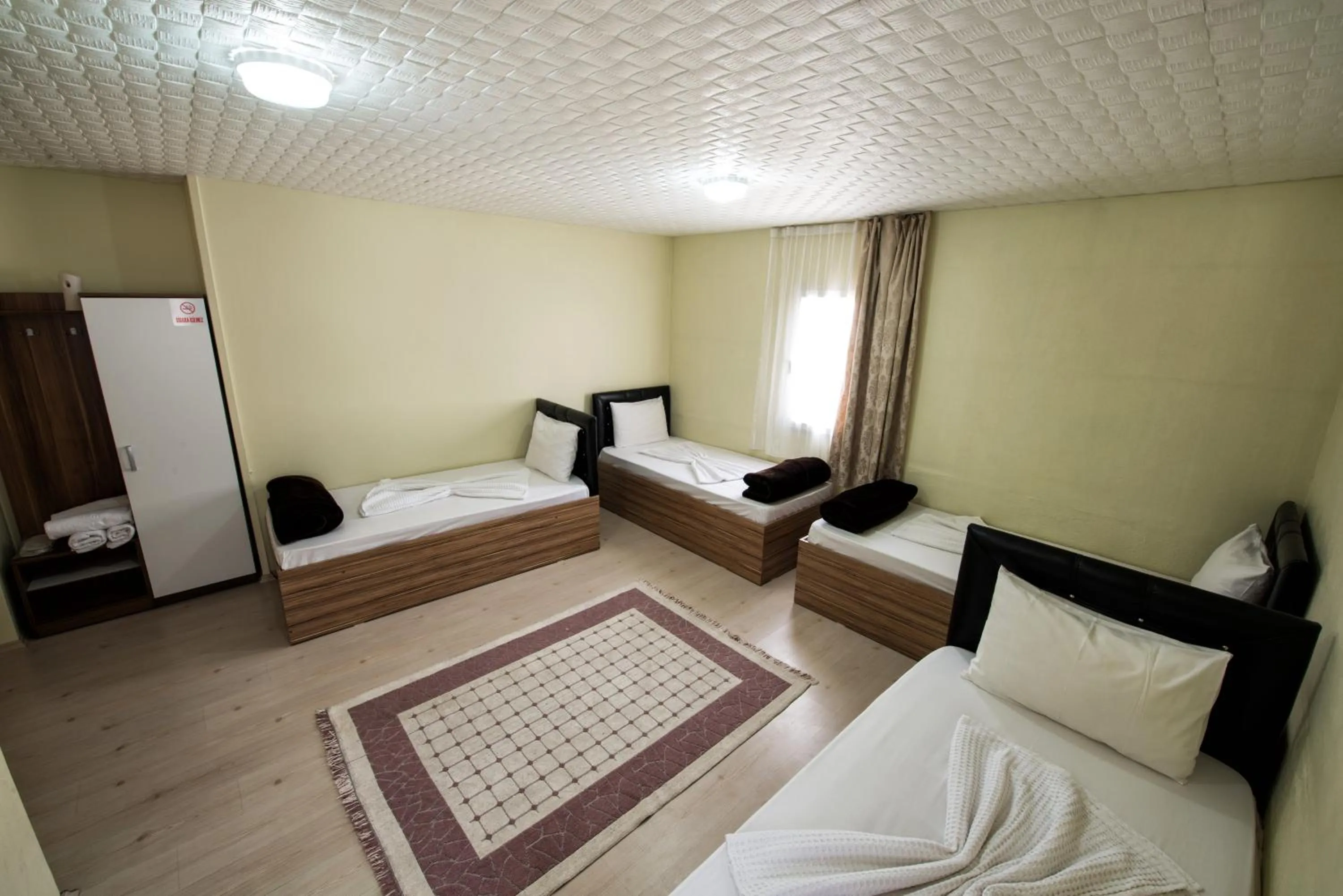 Bed in Yellow Rose Pansiyon