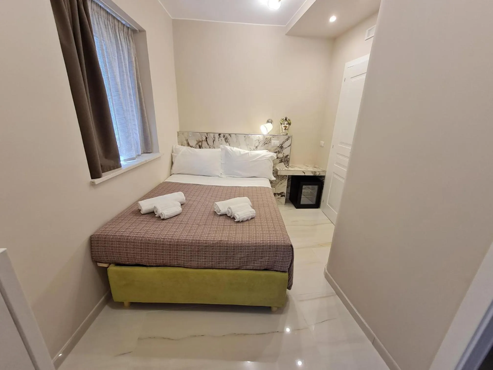 Bed in EPONIMI ROOMs