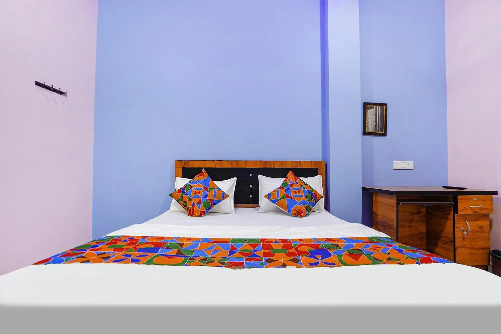 Bed in FabExpress Evaan Deluxe Rooms