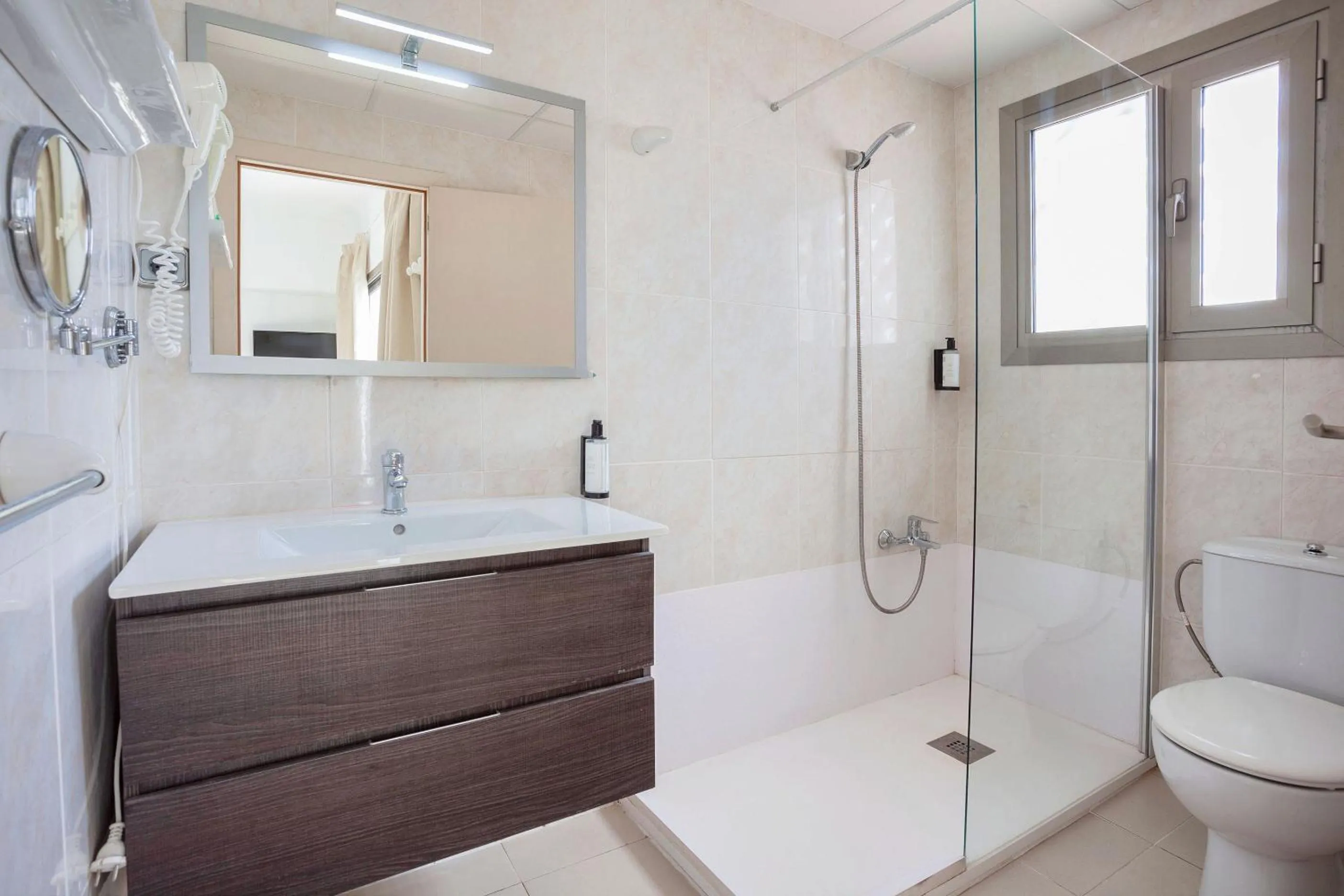 Bathroom in Petit Garden Hotel by Flacalco