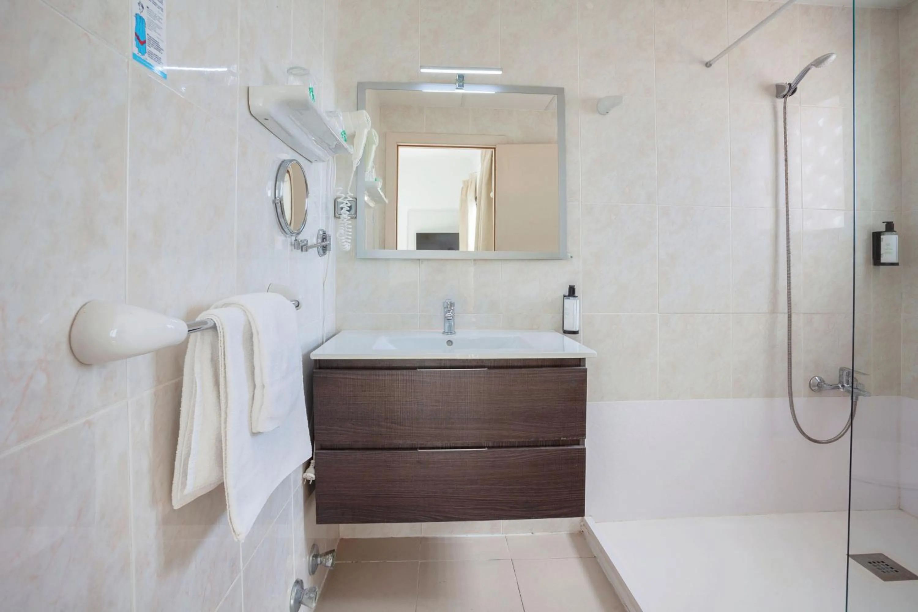 Bathroom in Petit Garden Hotel by Flacalco