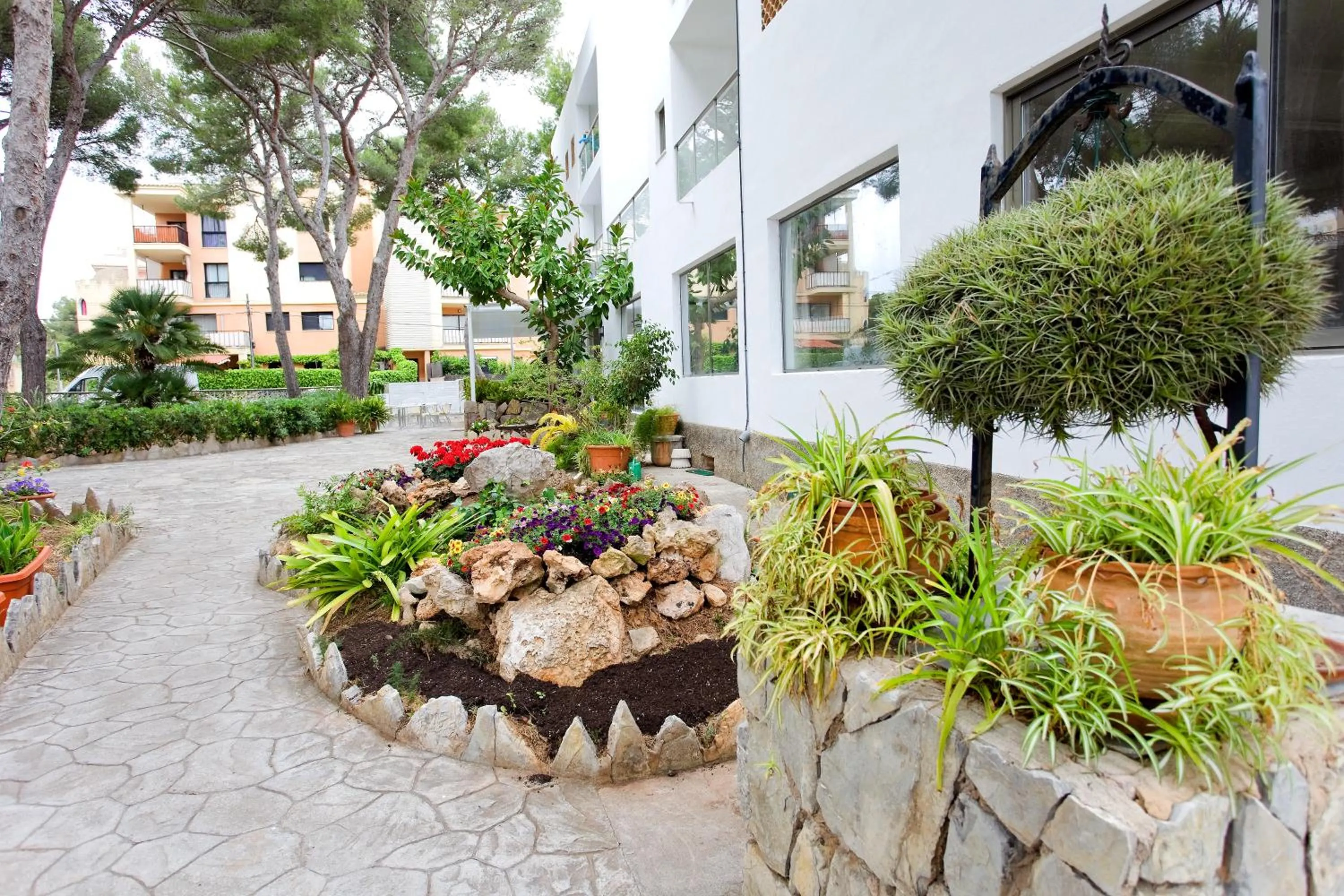 Property building, Garden in Petit Garden Hotel by Flacalco
