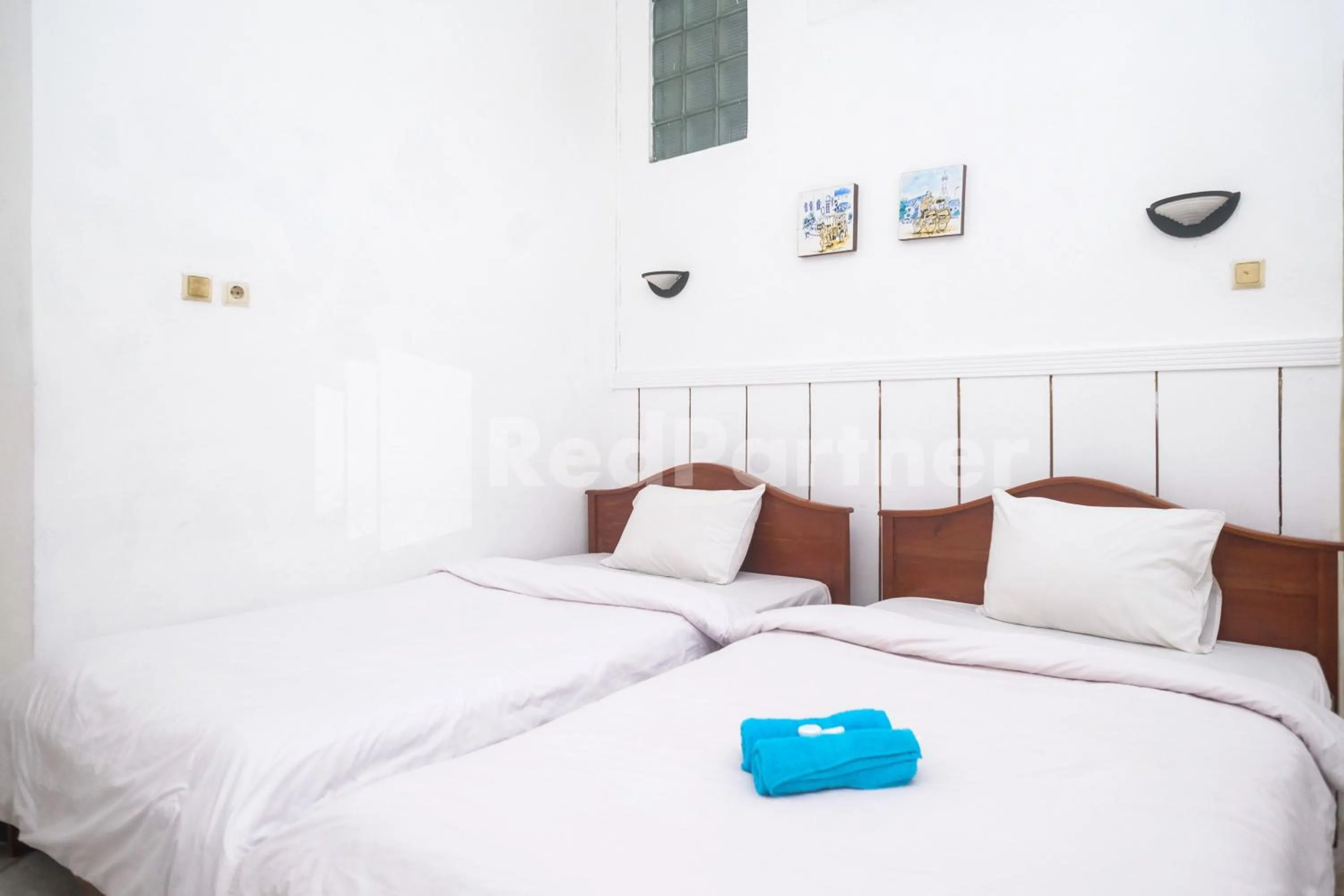 Bed in Hotel Limaran 1 Syariah Malioboro Mitra RedDoorz