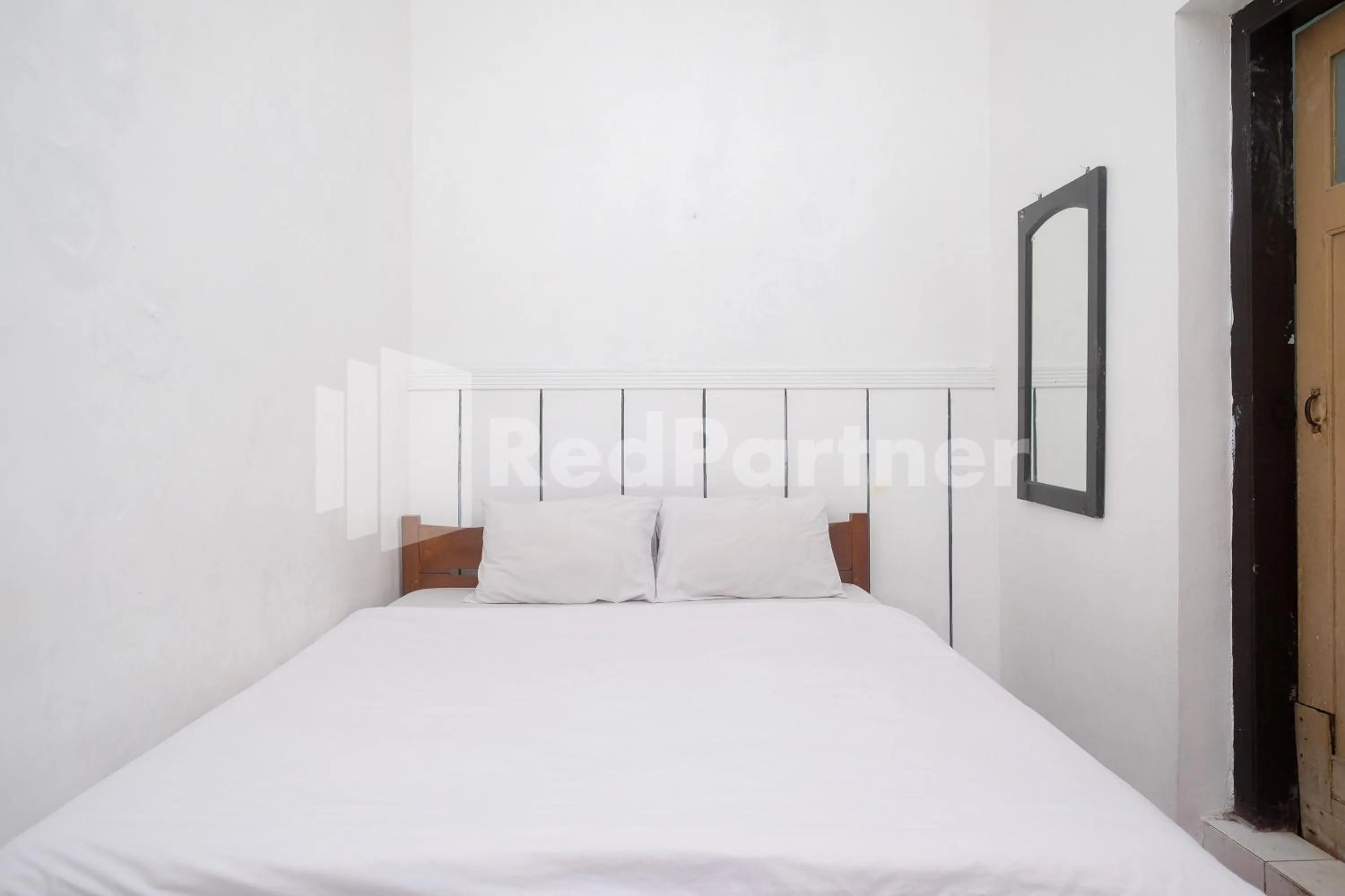 Bed in Hotel Limaran 1 Syariah Malioboro Mitra RedDoorz