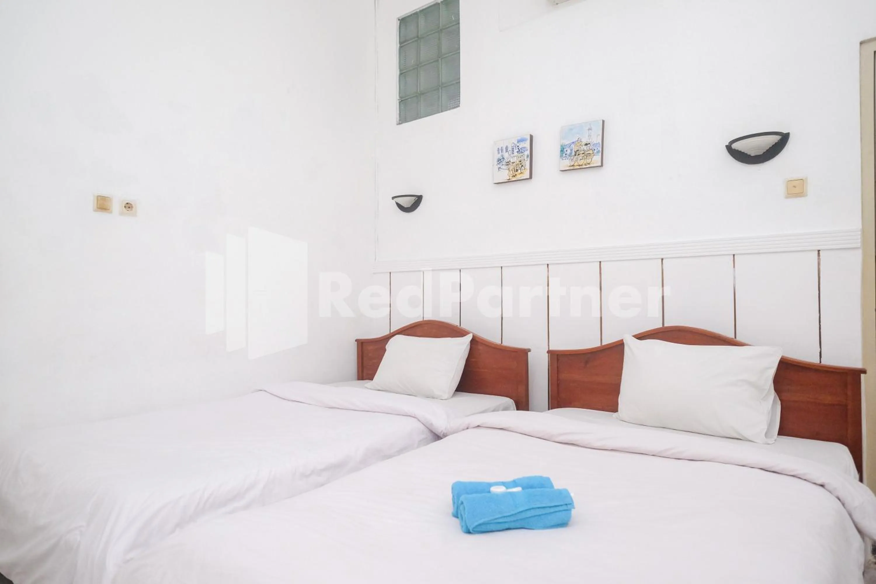 Bed in Hotel Limaran 1 Syariah Malioboro Mitra RedDoorz