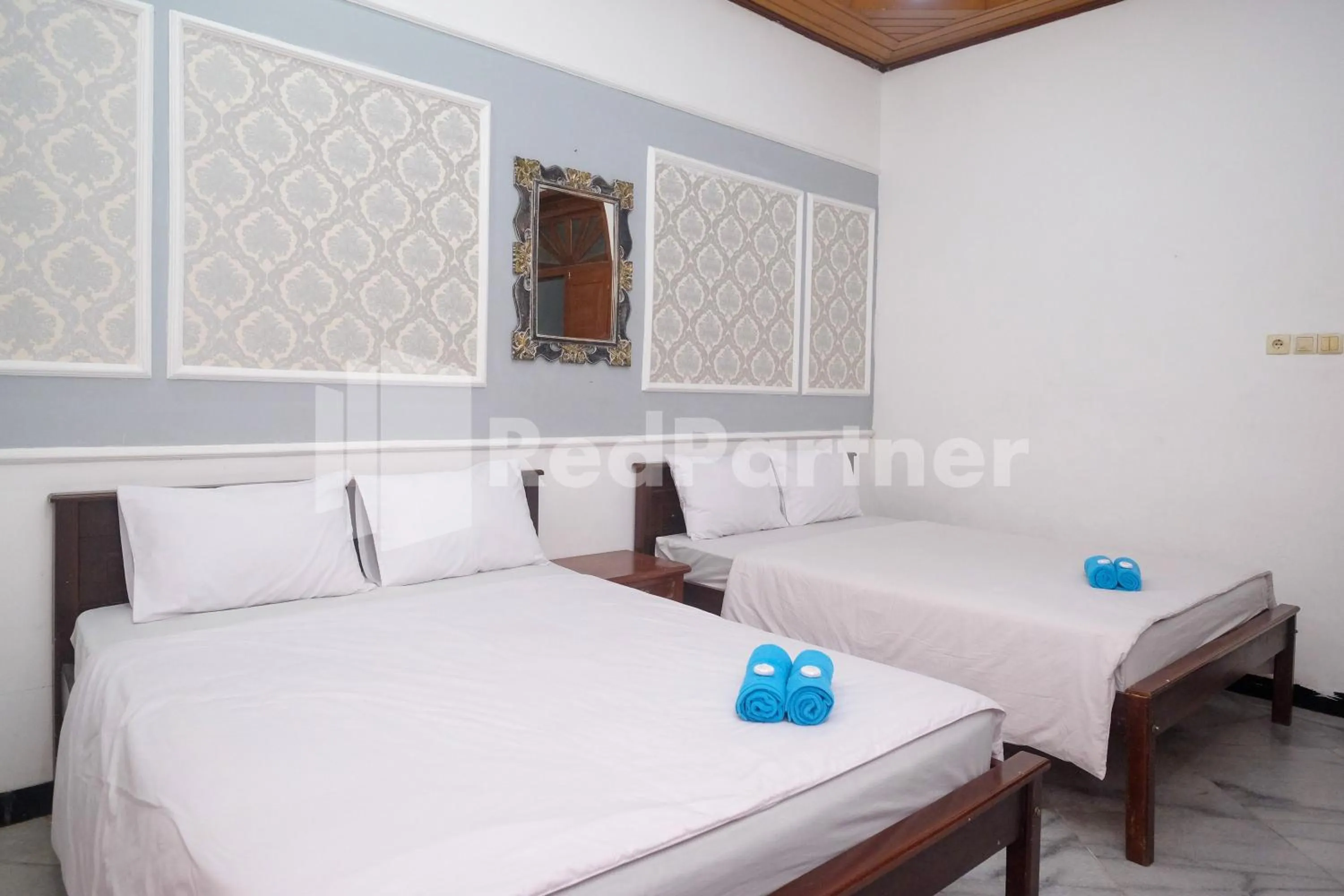 Bed in Hotel Limaran 1 Syariah Malioboro Mitra RedDoorz
