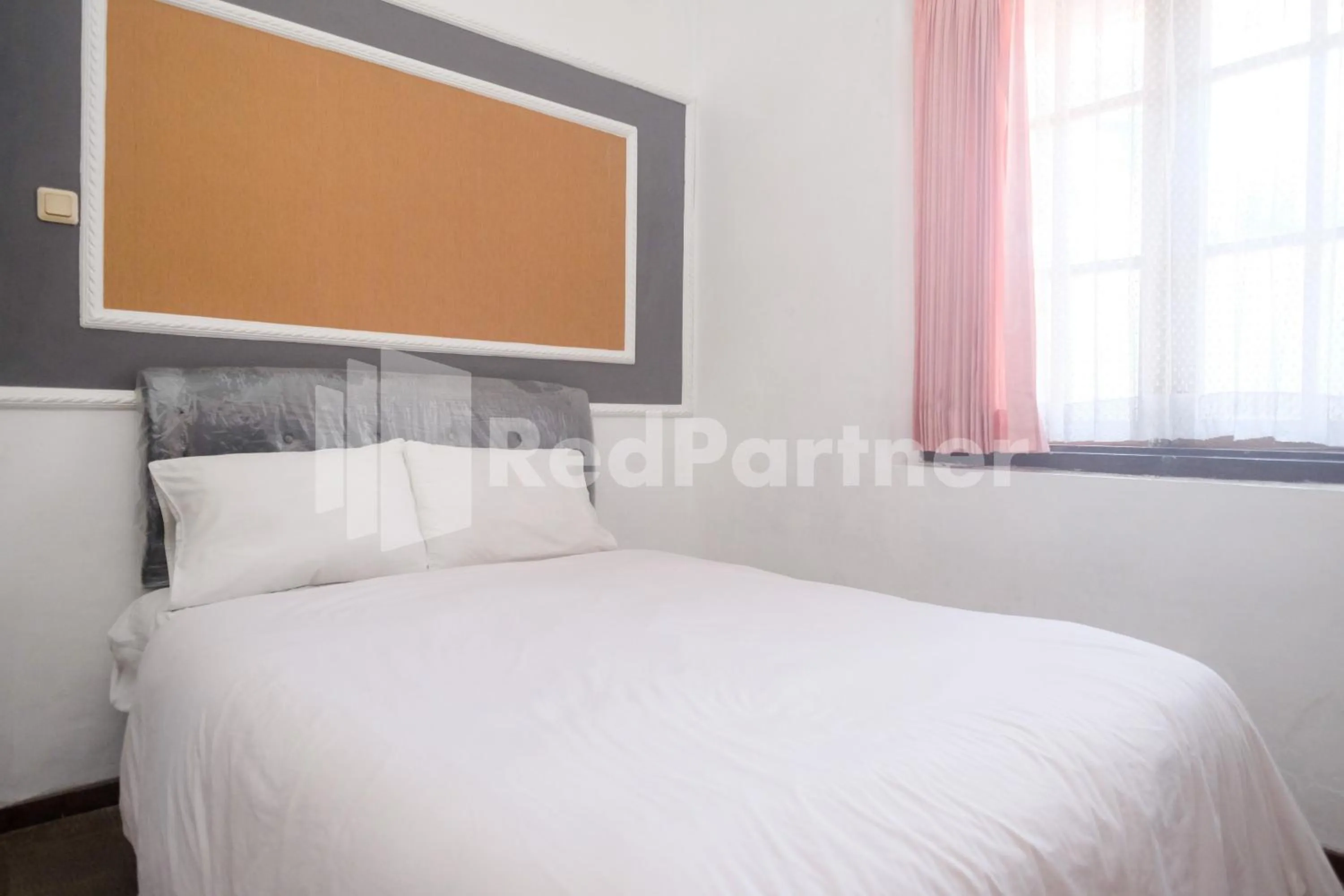 Bed in Hotel Limaran 1 Syariah Malioboro Mitra RedDoorz