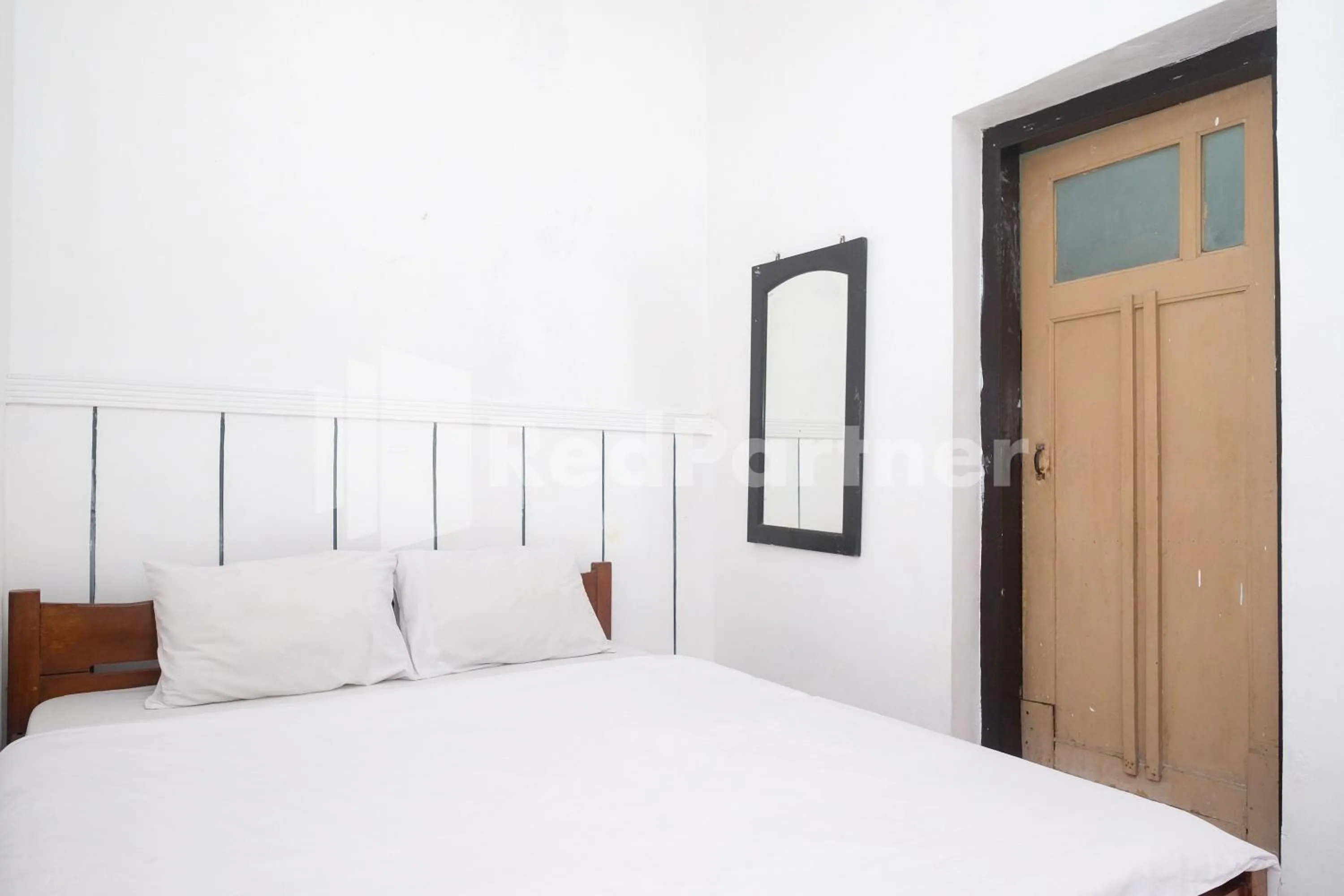 Bed in Hotel Limaran 1 Syariah Malioboro Mitra RedDoorz