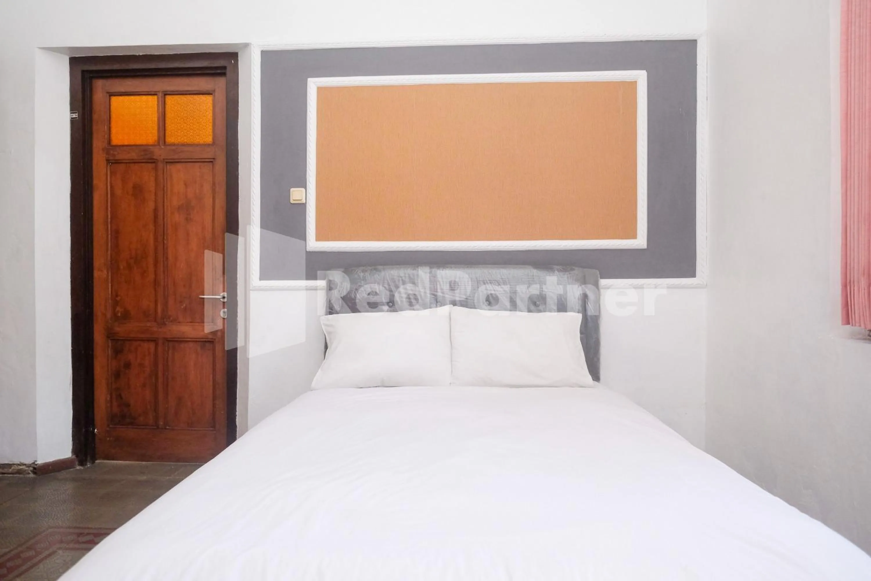 Bed in Hotel Limaran 1 Syariah Malioboro Mitra RedDoorz