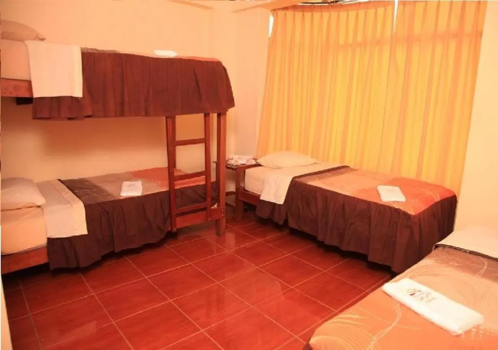 Photo of the whole room, Bed in Hostal Huacachina Sunset