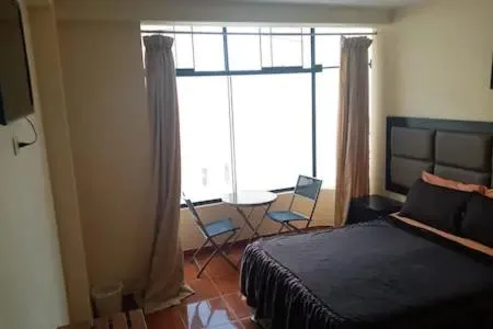 Bed in Hostal Huacachina Sunset