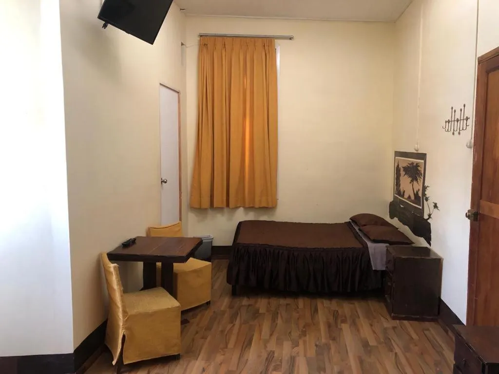 Bed in Hostal Huacachina Sunset