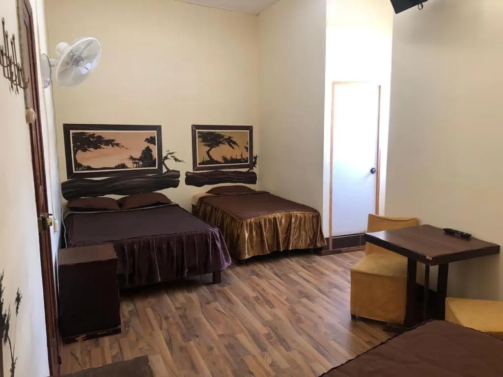 Bed in Hostal Huacachina Sunset