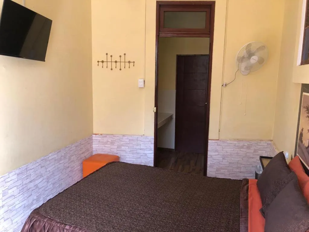 Bed in Hostal Huacachina Sunset