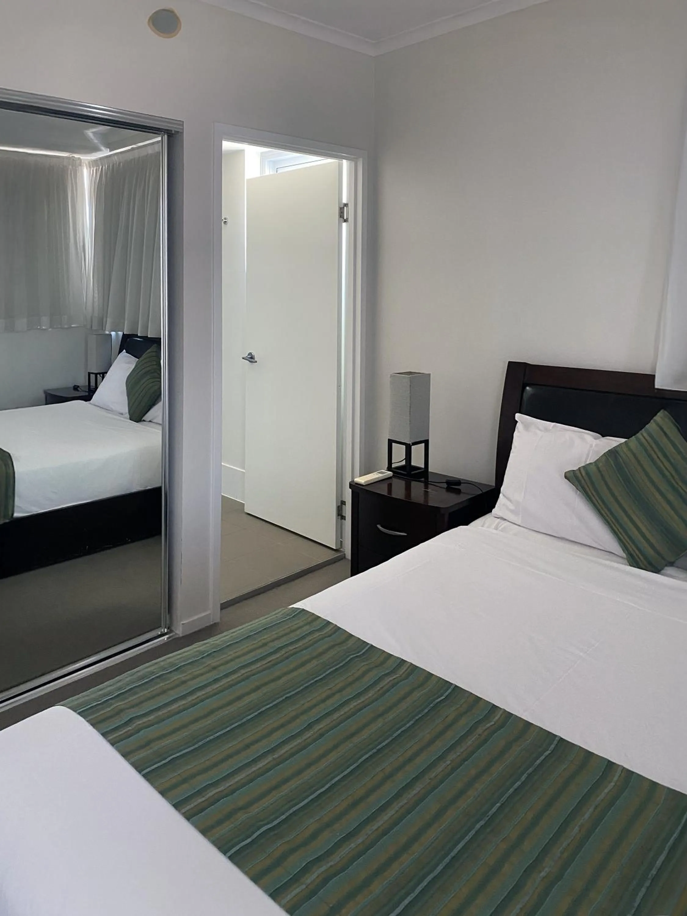 Bed in Curtis Central Apartments Official