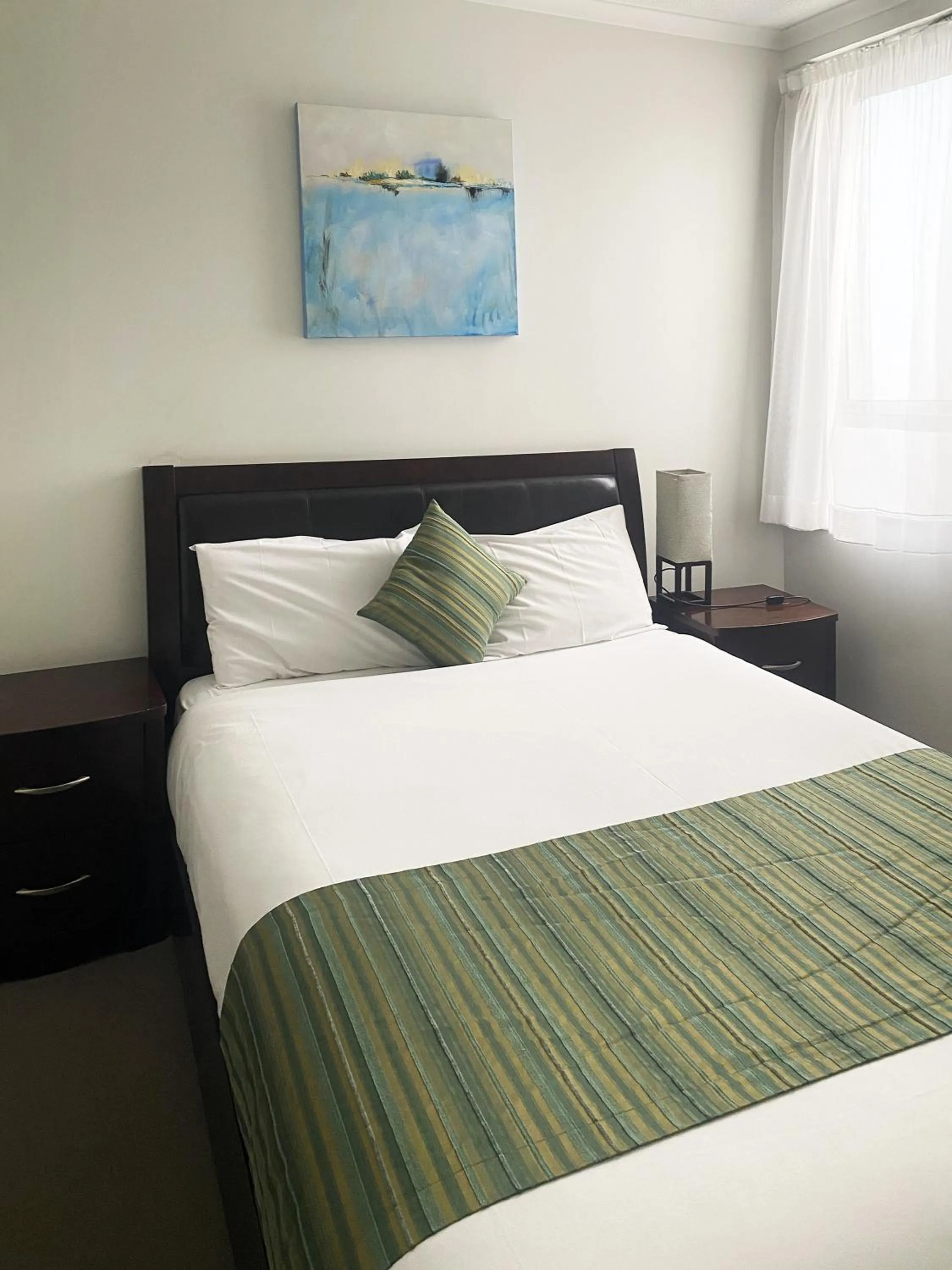 Bedroom, Bed in Curtis Central Apartments Official