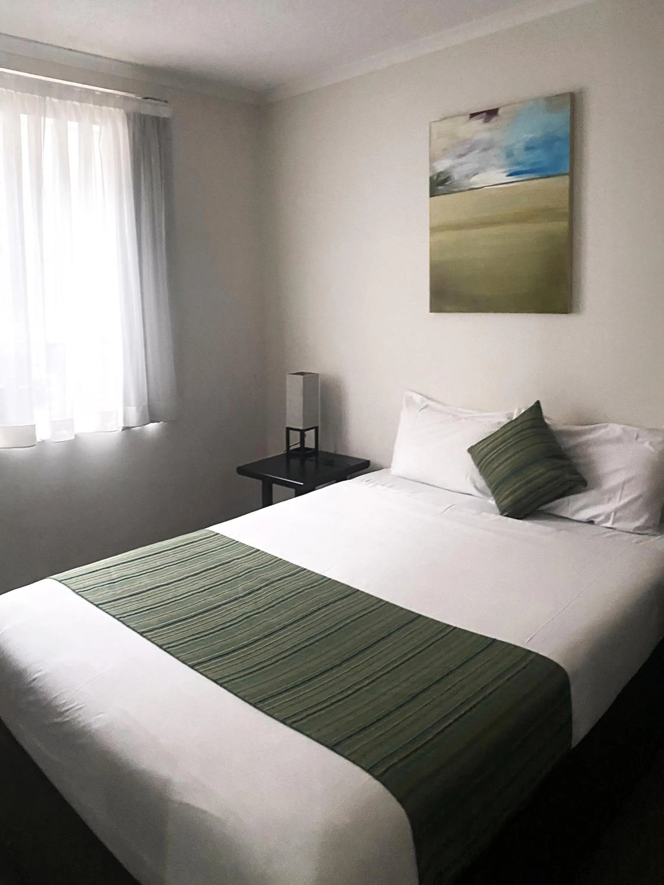 Bedroom, Bed in Curtis Central Apartments Official