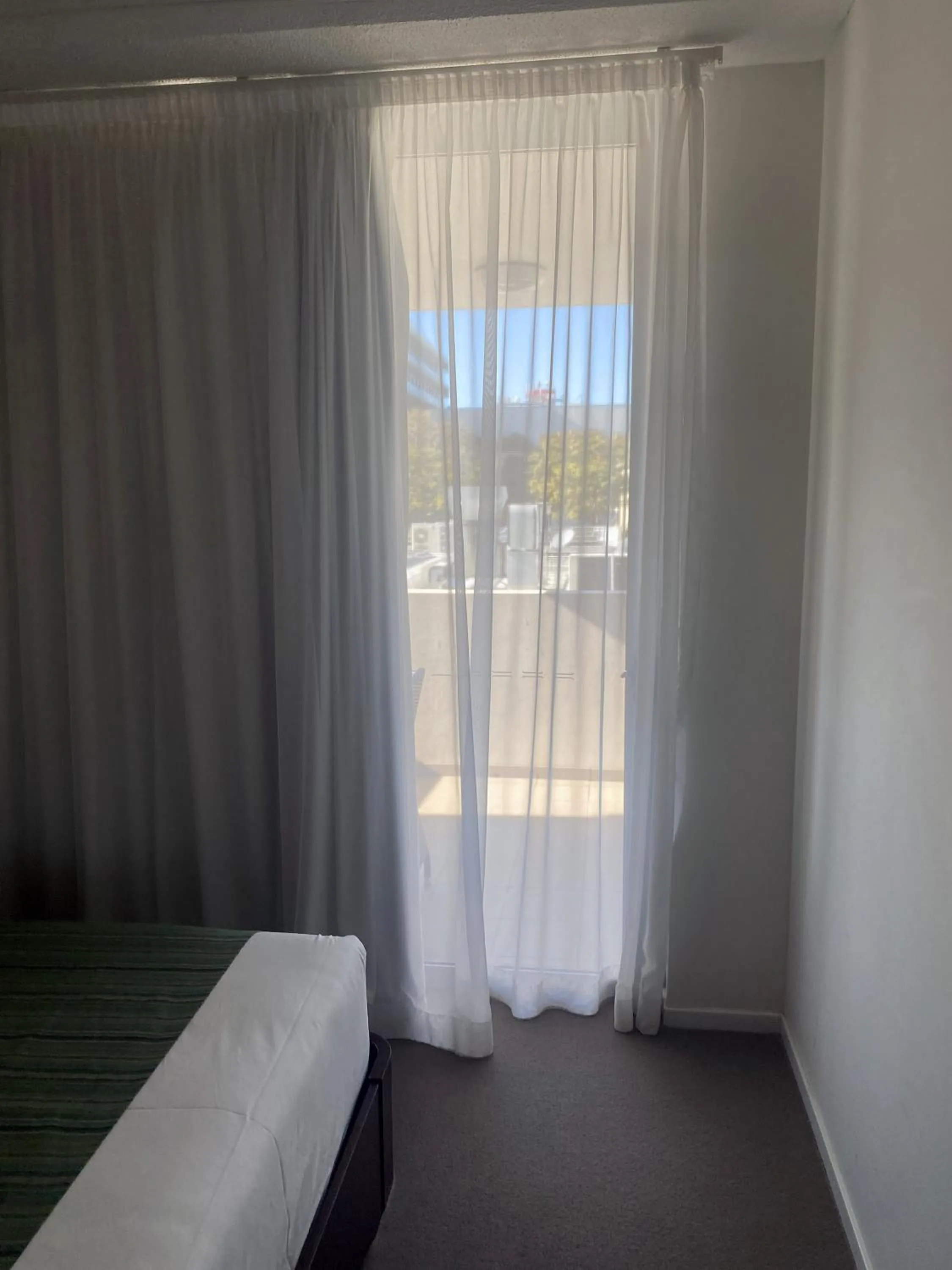 Bed in Curtis Central Apartments Official