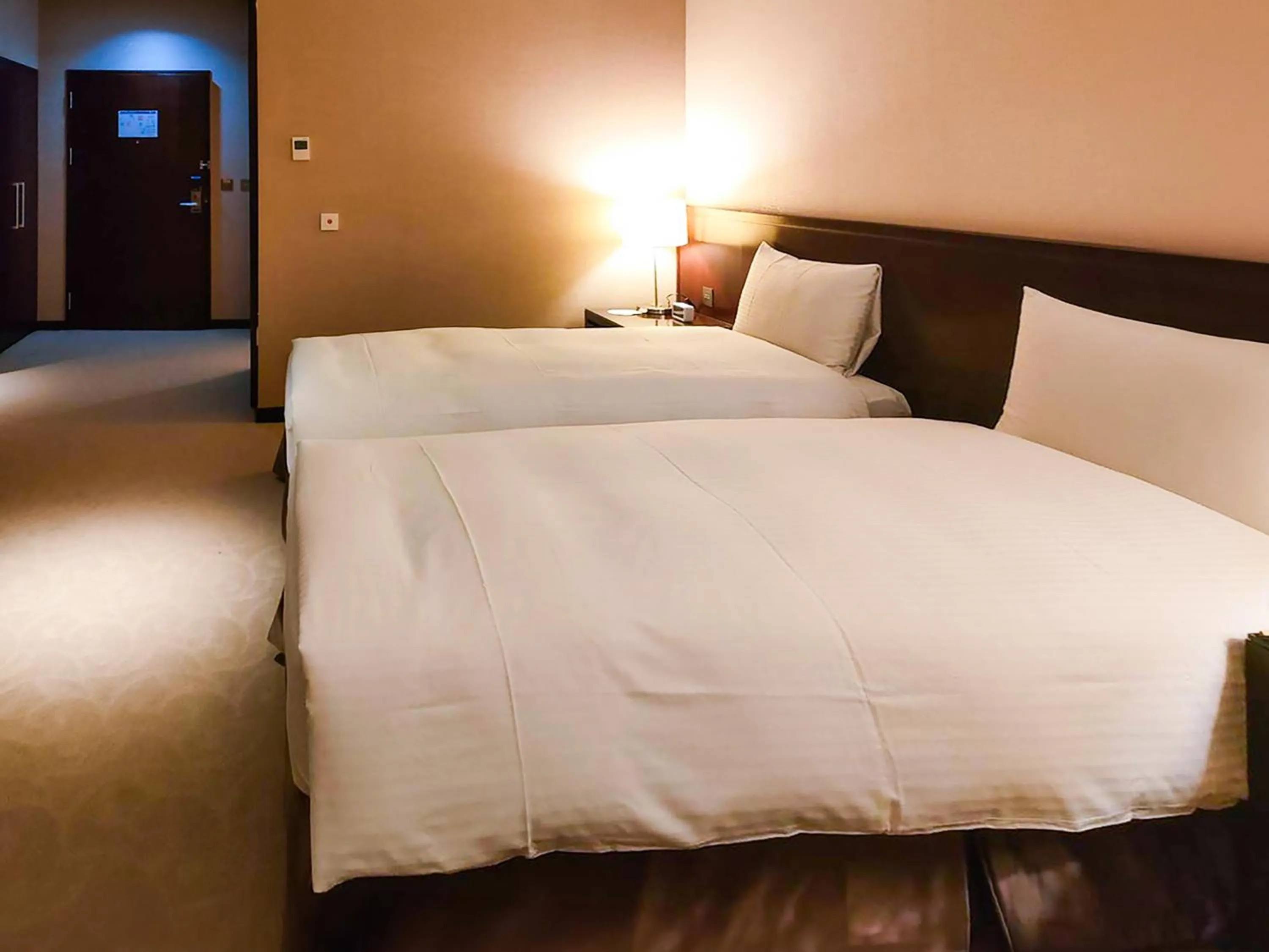 Bed in 雀客旅館台中來來