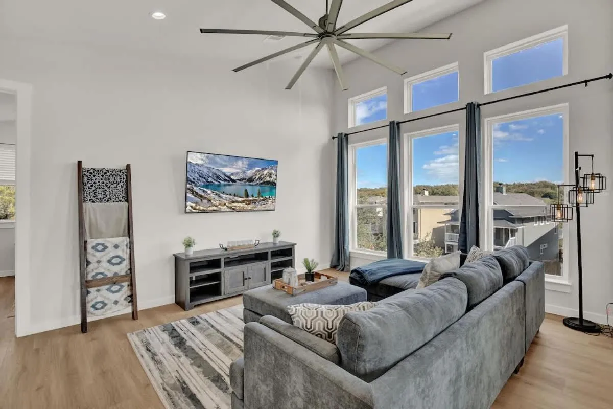 TV and multimedia in Stunning Lake Home with Pool-Beach-Gym-Boat Access