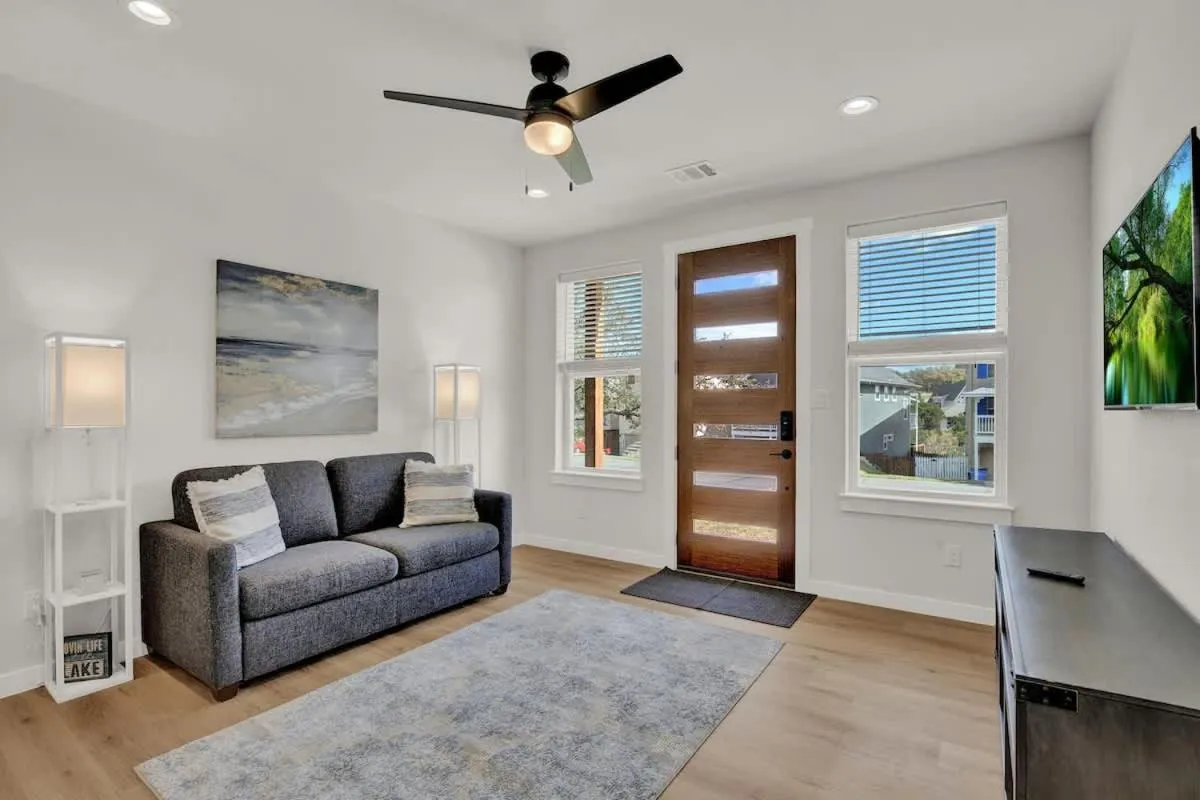 TV and multimedia in Stunning Lake Home with Pool-Beach-Gym-Boat Access