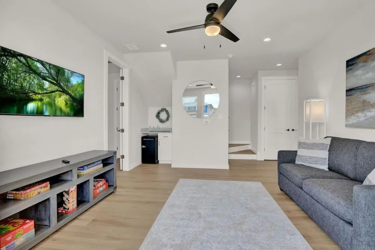 TV and multimedia in Stunning Lake Home with Pool-Beach-Gym-Boat Access