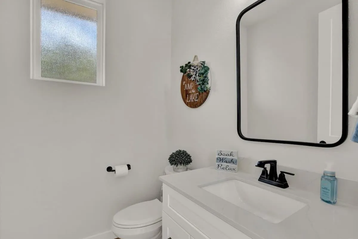 Toilet in Stunning Lake Home with Pool-Beach-Gym-Boat Access