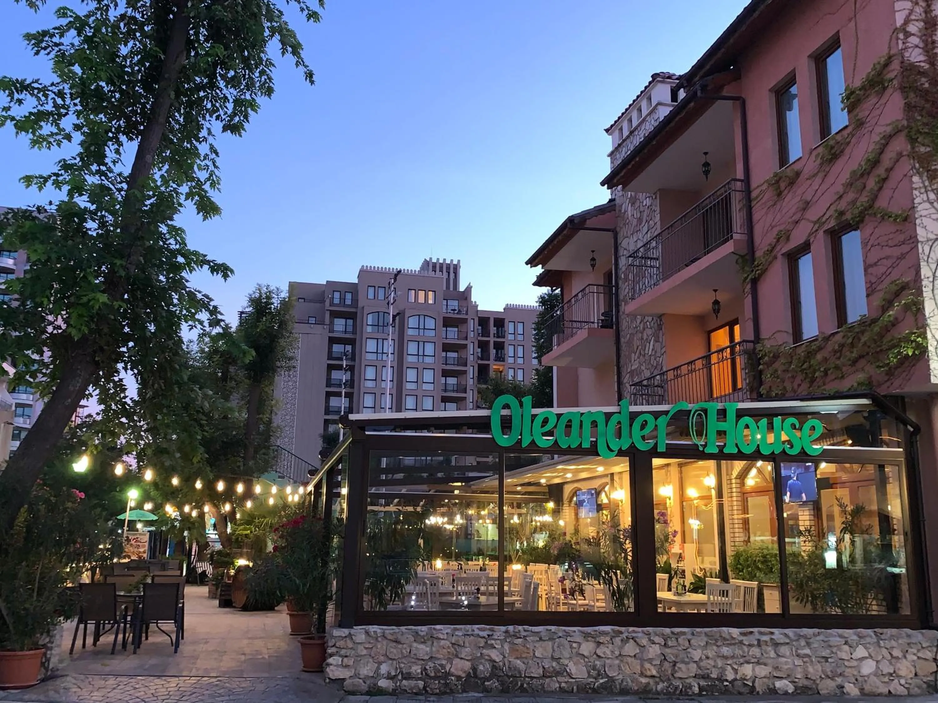 Property logo or sign in Oleander House and Tennis Club