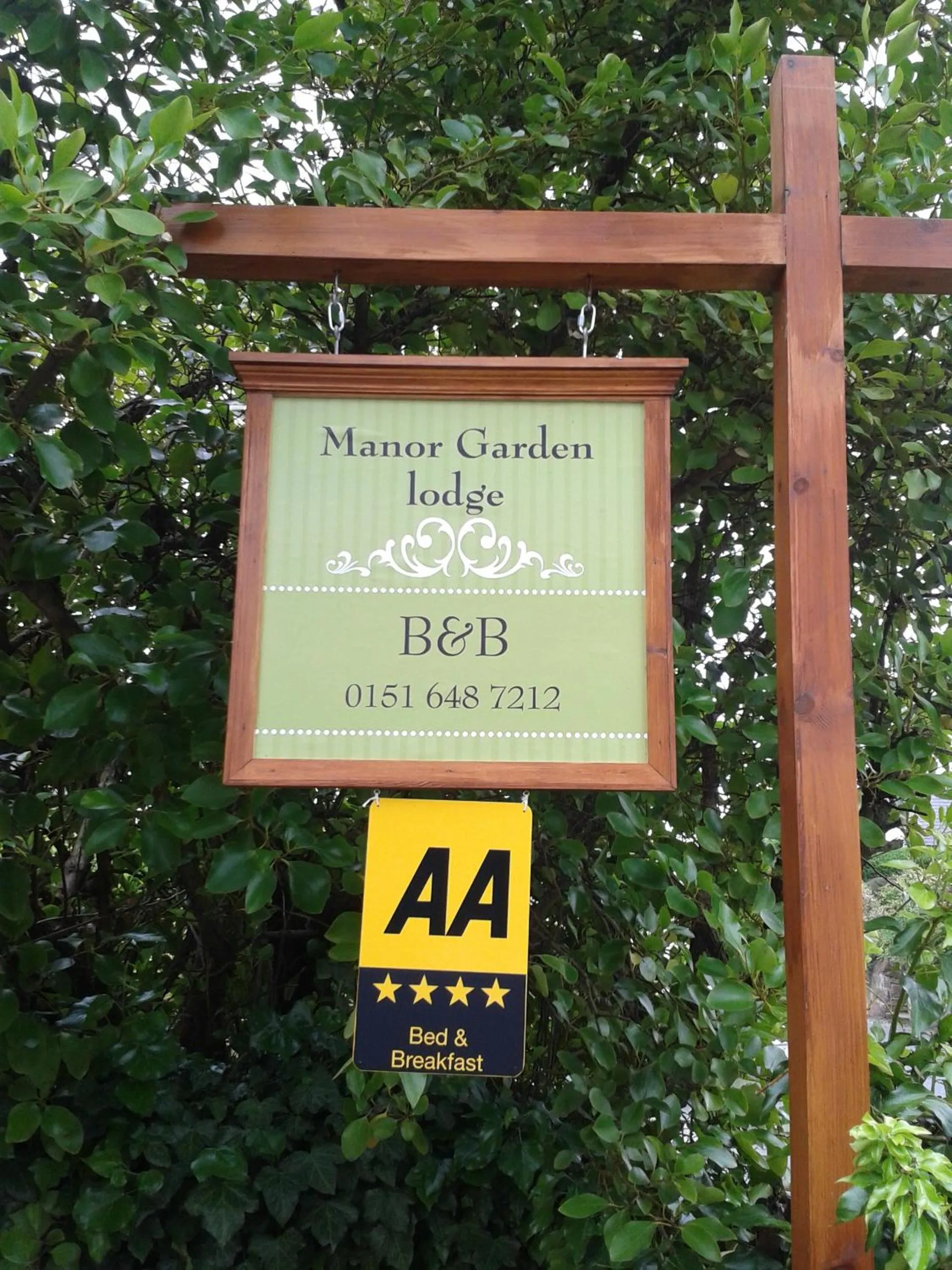 Property logo or sign in Manor Garden Lodge