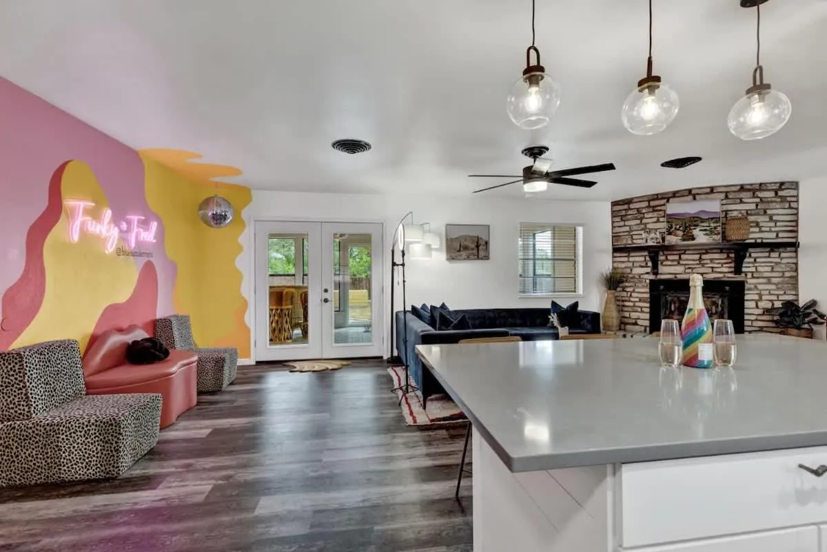 Living room in Eclectic Fun Haus with Hot Tub - 3 Min Drive to Main