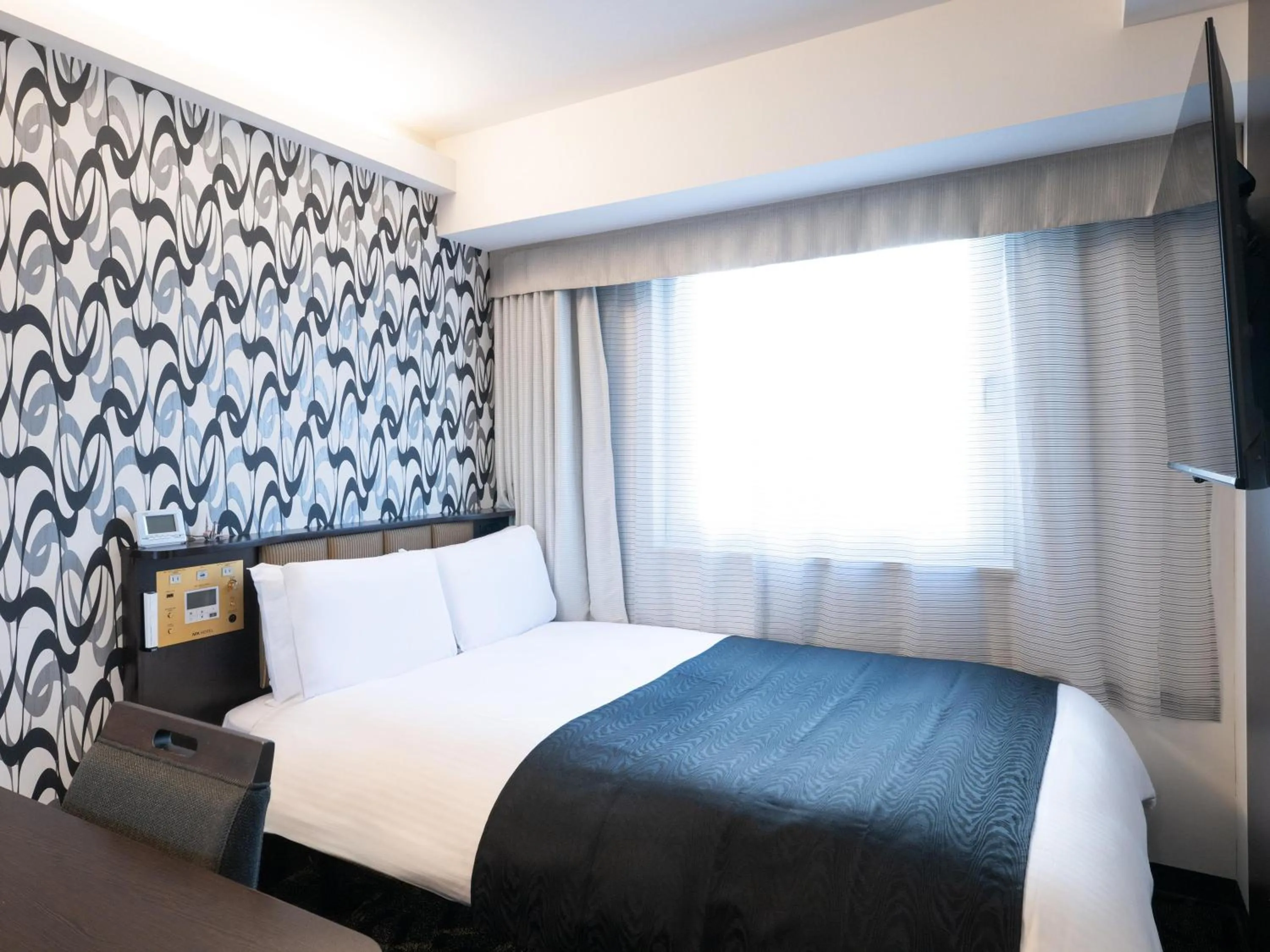 Photo of the whole room, Bed in APA Hotel Hatchobori Ekimae