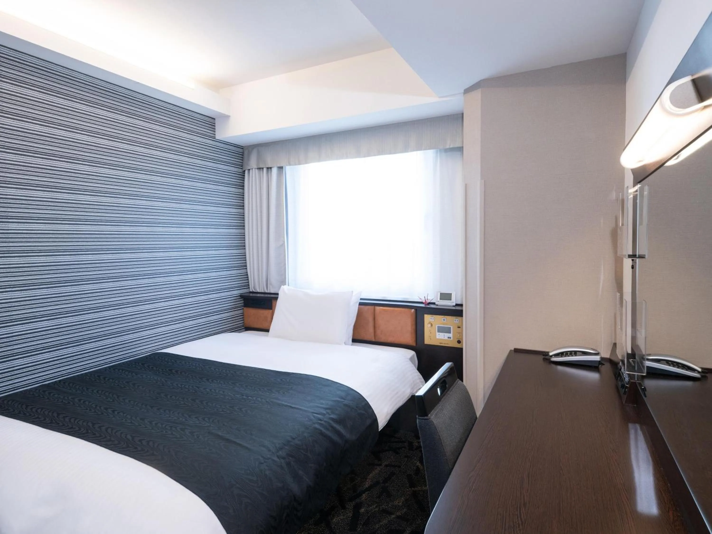 Photo of the whole room, Bed in APA Hotel Hatchobori Ekimae