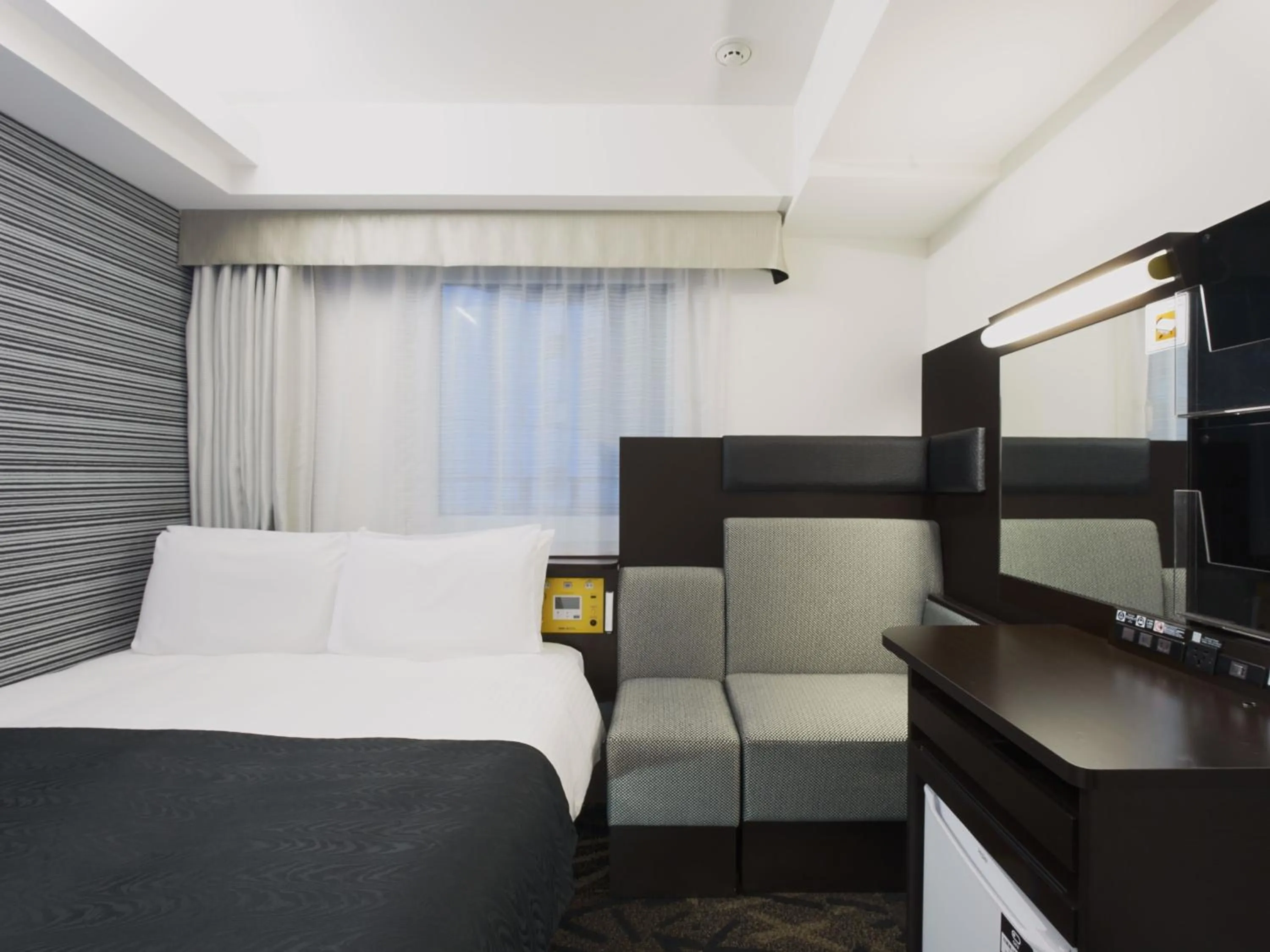 Photo of the whole room, Bed in APA Hotel Hatchobori Ekimae