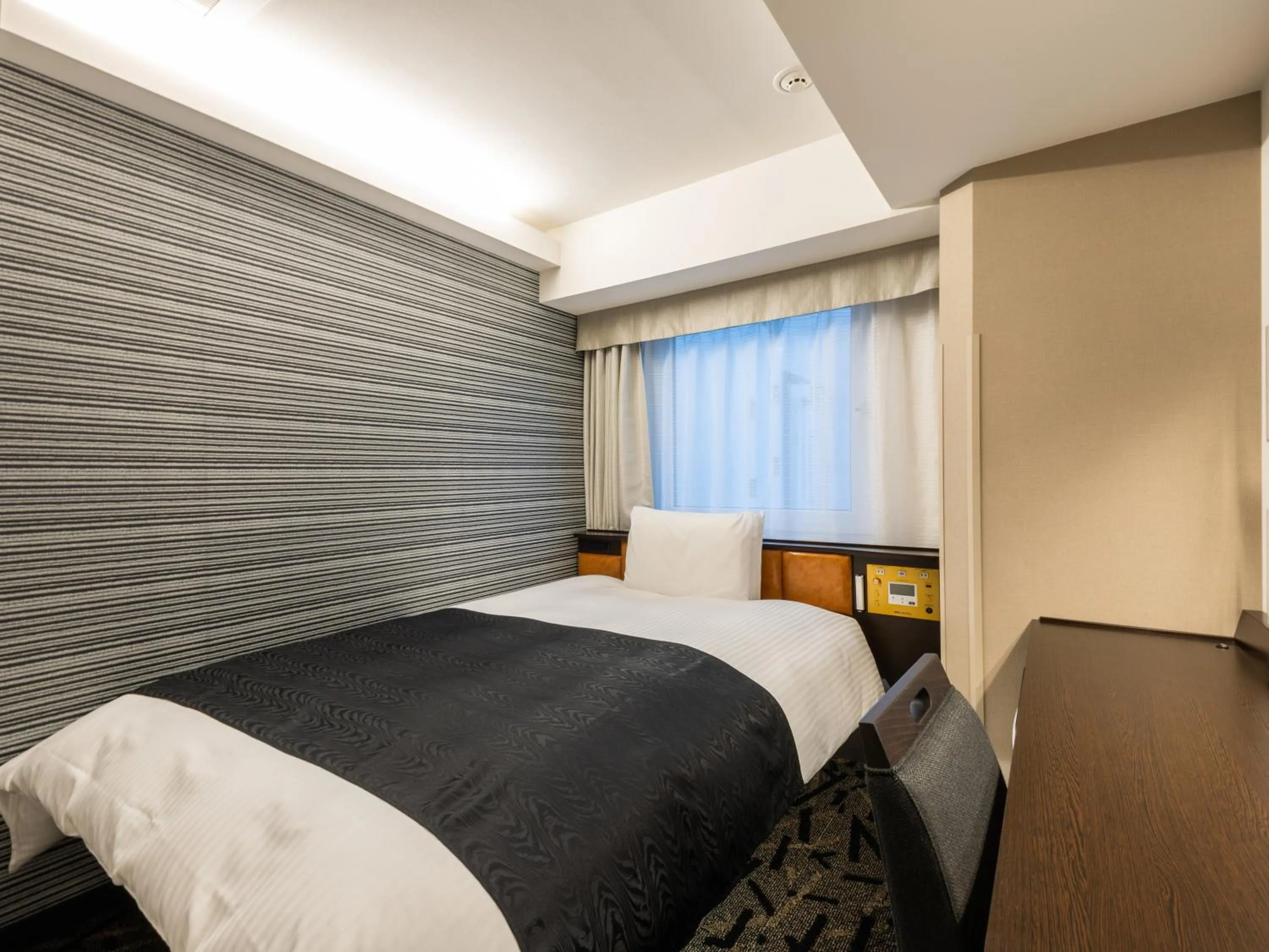 Photo of the whole room, Bed in APA Hotel Hatchobori Ekimae
