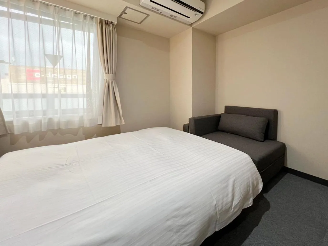 Bed in CHECKinn Osaka Shinimamiya