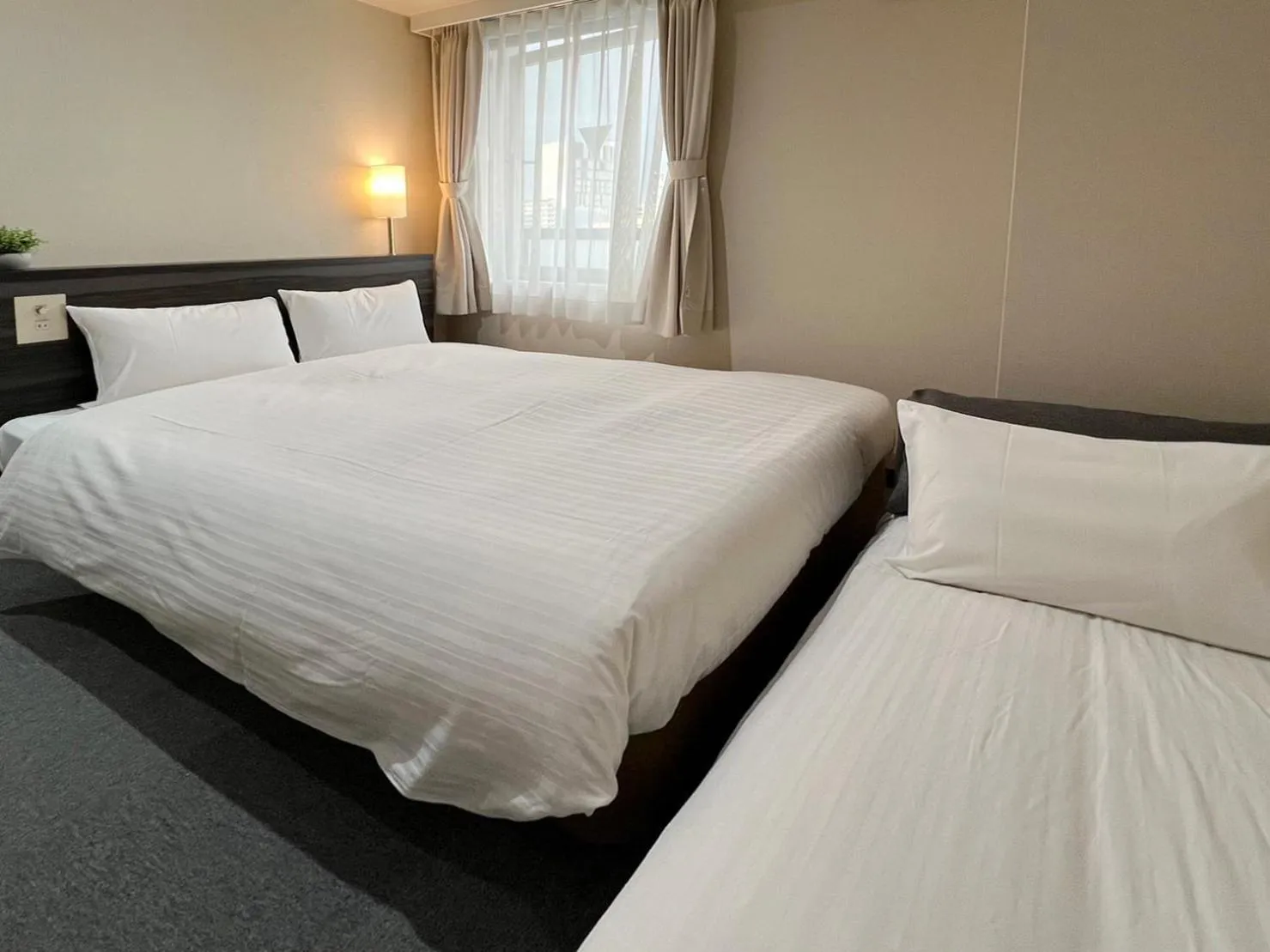 Bed in CHECKinn Osaka Shinimamiya