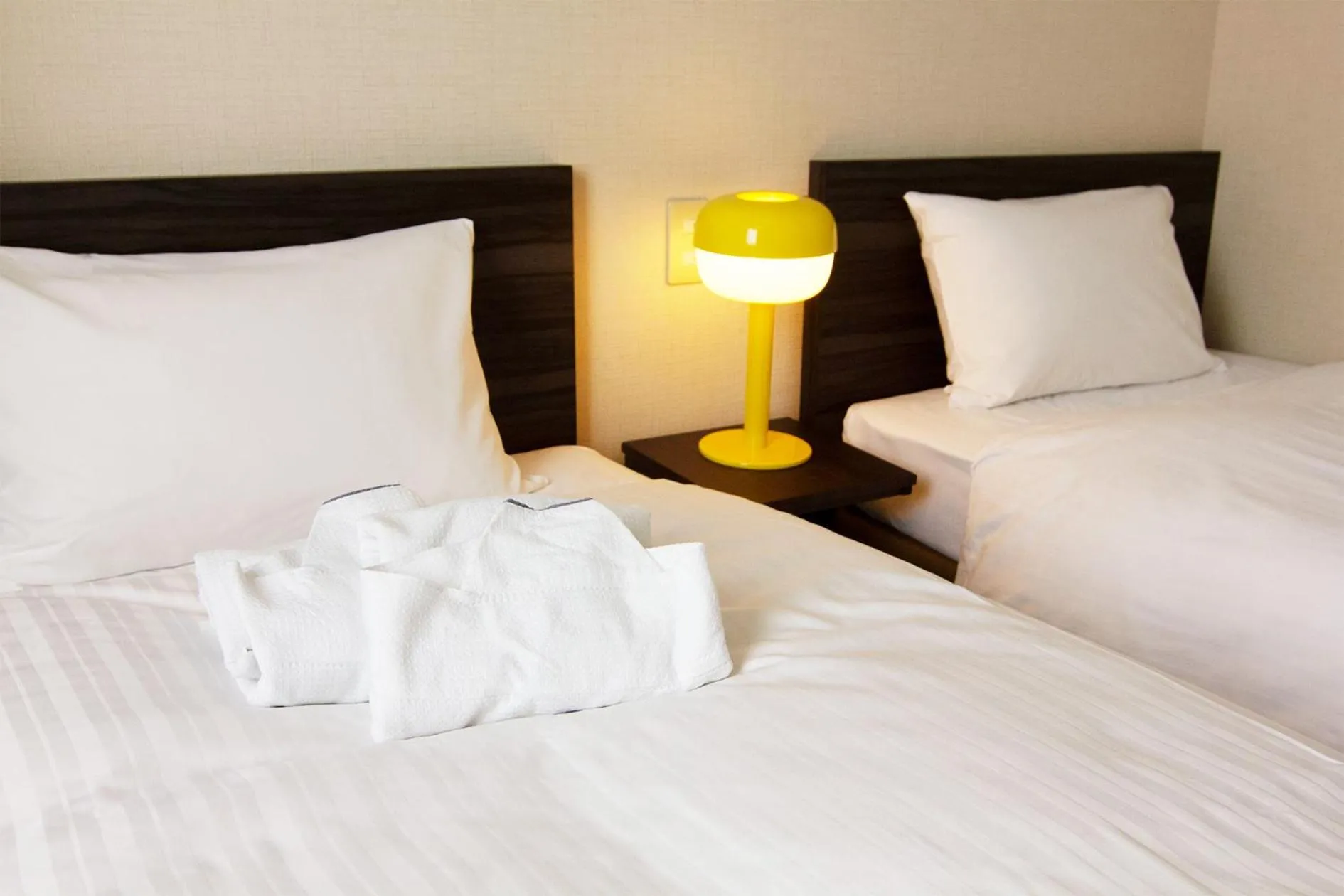 Bed in CHECKinn Osaka Shinimamiya