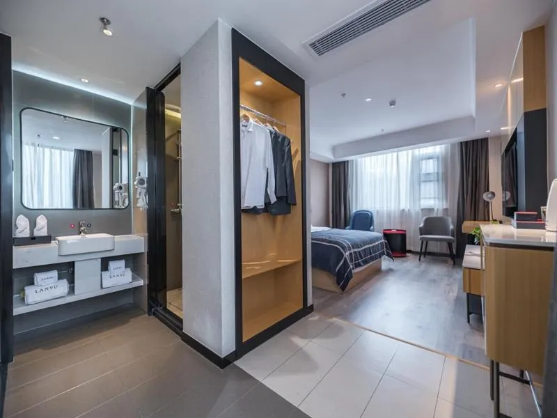 Bed in LanOu Hotel Wuxi Anzhen East High-Speed Railway Station